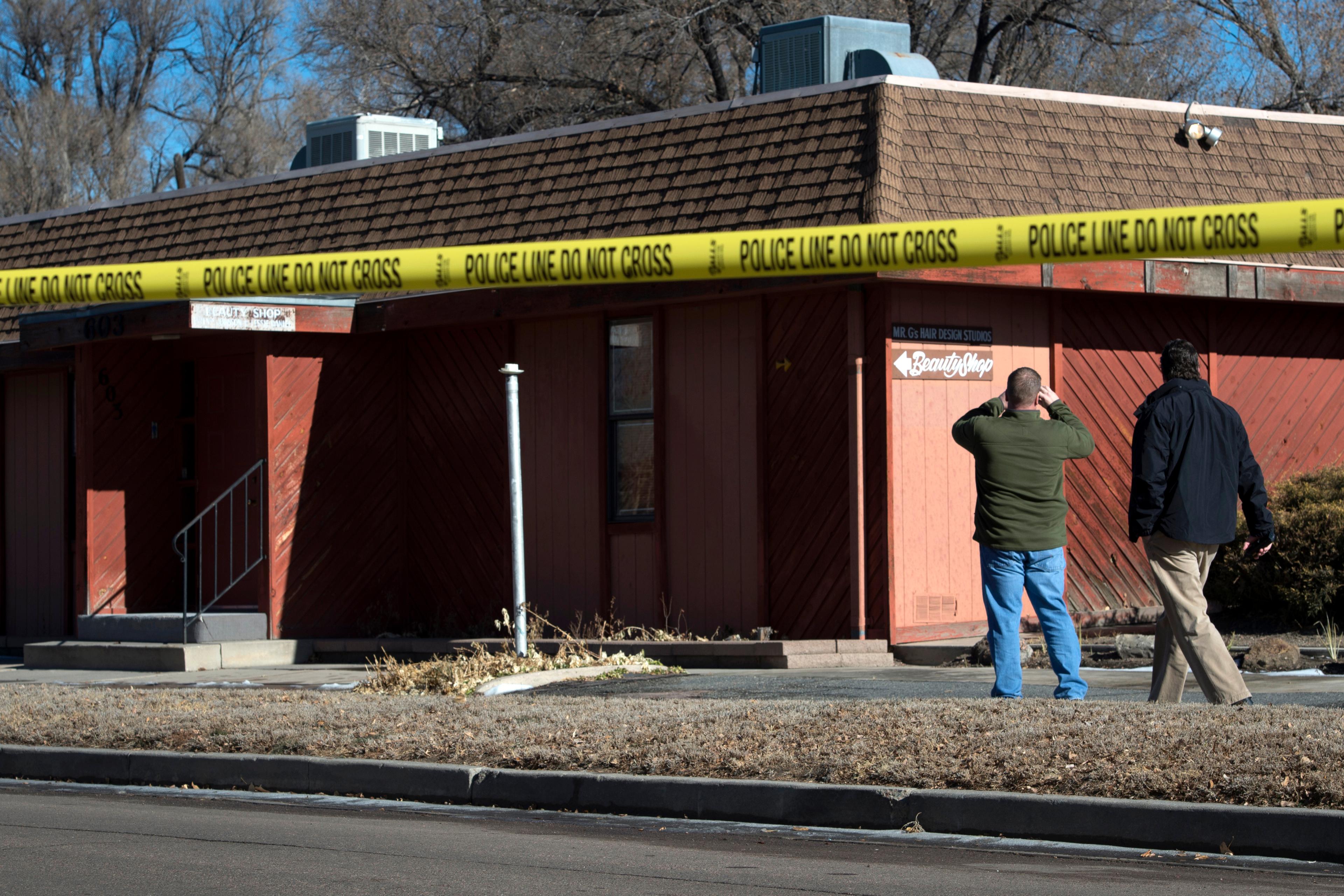 Colorado Springs police officers investigate the scene of an explosion on Jan. 6, 2015, at a building in Colorado Springs, Colo.