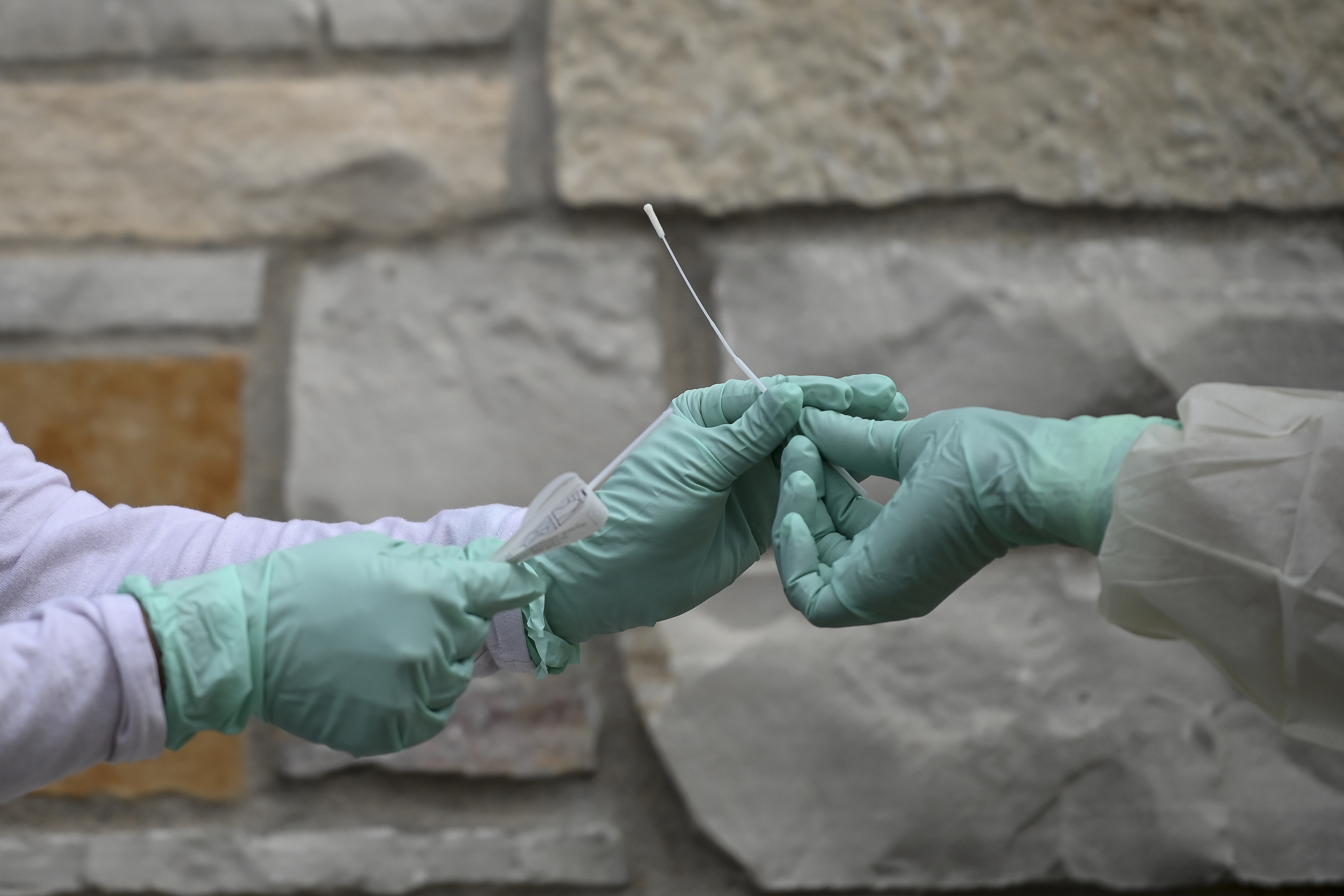 Fridley health workers demonstate COVID-19 drive-up testing