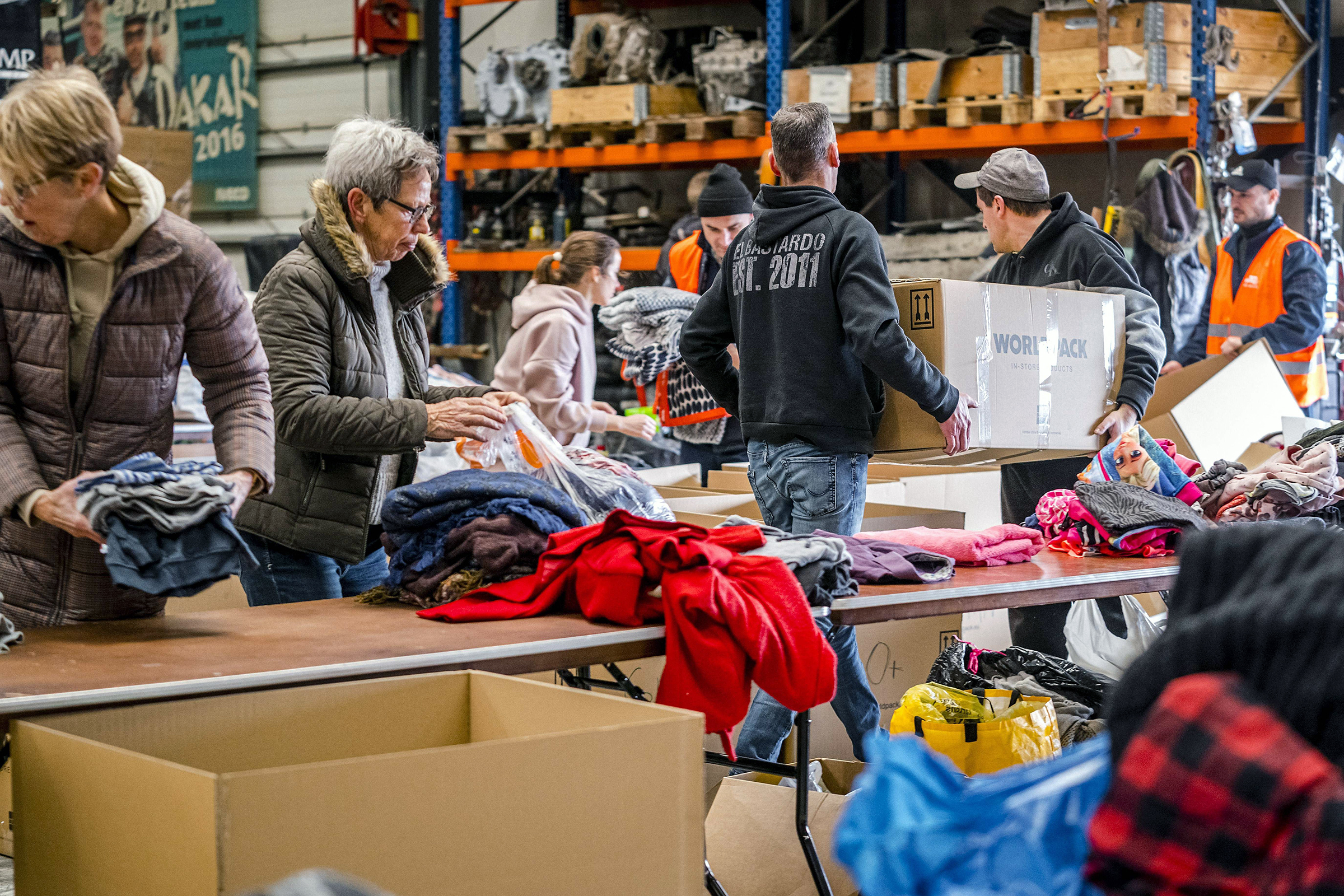 Volunteers collect and pack household necessities to be sent to Ukraine