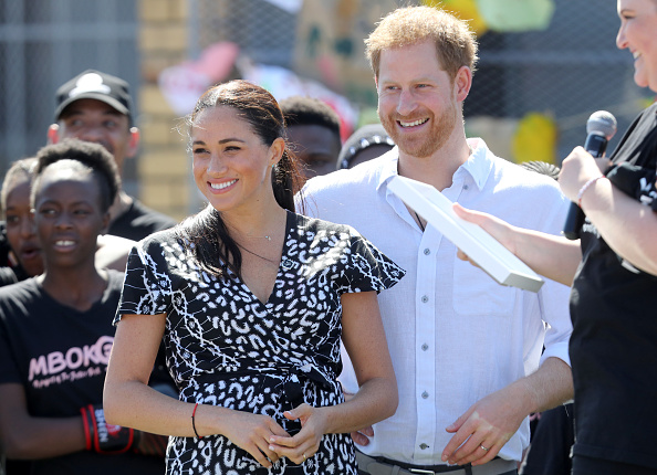 Meghan, Duchess of Sussex and Prince Harry, Duke of Sussex smile as they visit a Justice Desk initiative in Nyanga township, during their royal tour of South Africa in Cape Town, South Africa on September 23, 2019.