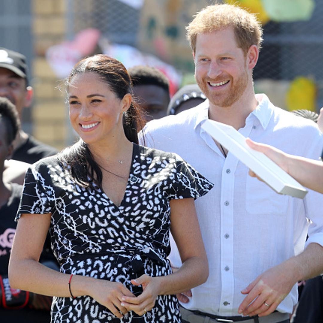 Meghan, Duchess of Sussex and Prince Harry, Duke of Sussex smile as they visit a Justice Desk initiative in Nyanga township, during their royal tour of South Africa in Cape Town, South Africa on September 23, 2019.