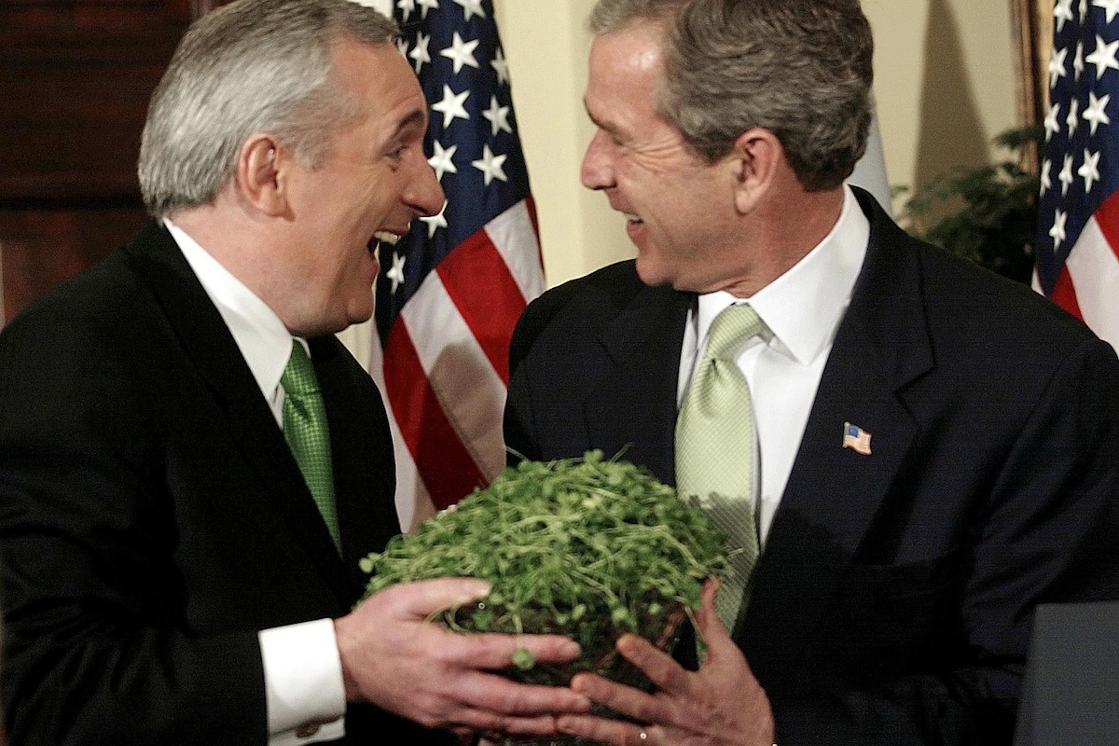 US President George W. Bush receives a bowl of sha