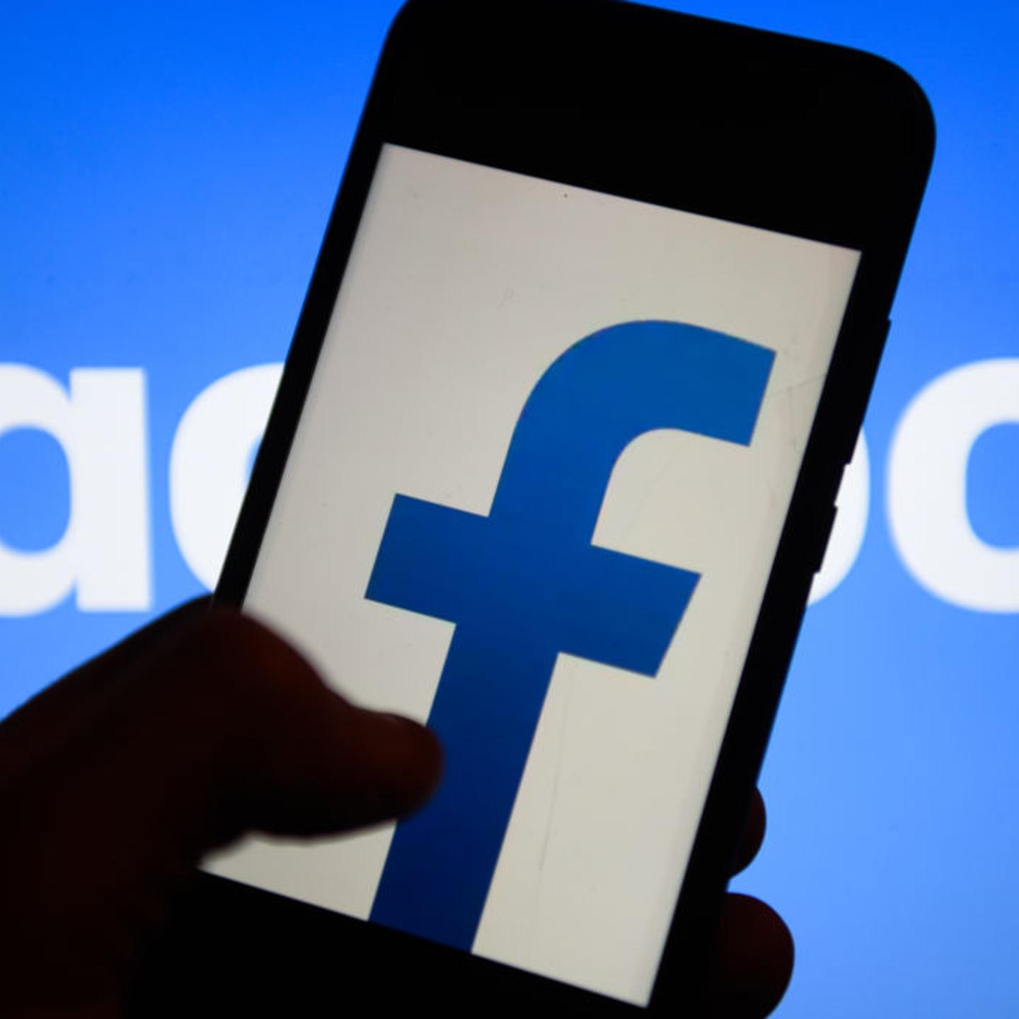Facebook logo is seen on an android mobile phone