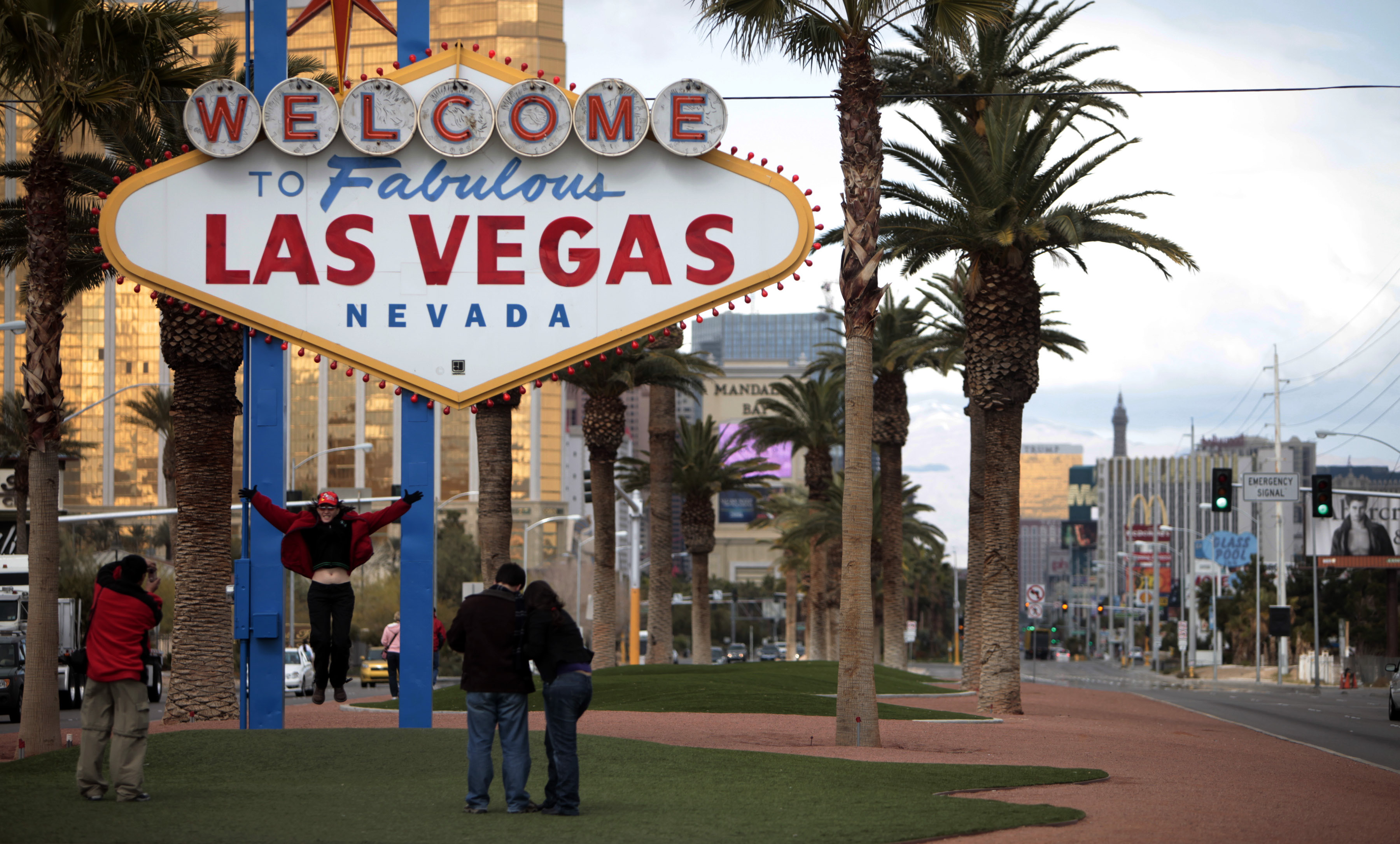 Tourists take pictures on Feb 12, 2009 in front of the "Welcome to Fabulous Las Vegas" neon sign in Las Vegas. Betty Willis, the woman who designed the iconic neon sign that has welcomed countless visitors to Las Vegas since 1959 has died.