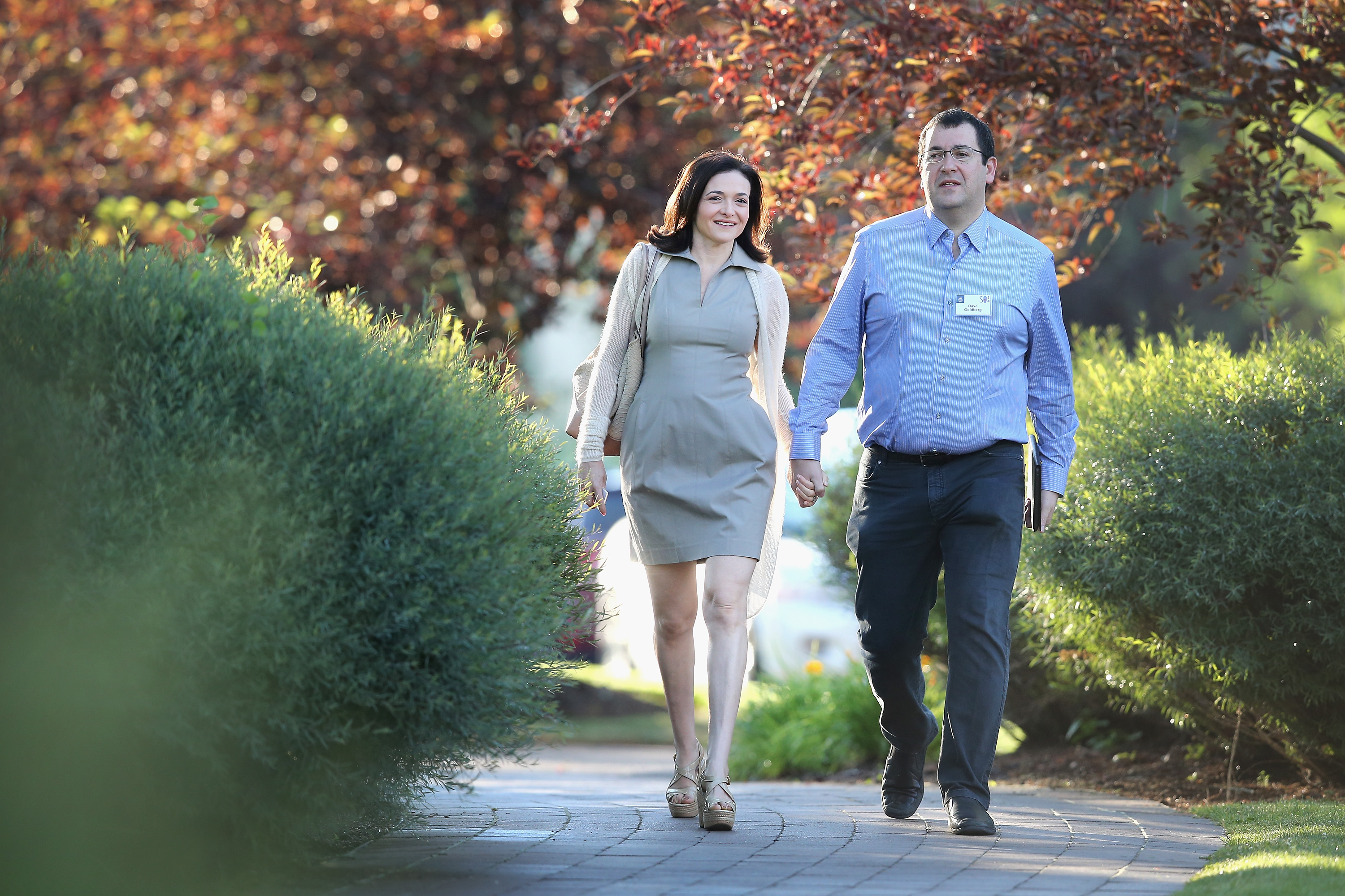 Sheryl Sandberg, chief operating officer (COO) of Facebook, and her husband David Goldberg, CEO of SurveyMonkey, attend the Allen & Company Sun Valley Conference on July 9, 2014 in Sun Valley, Idaho.