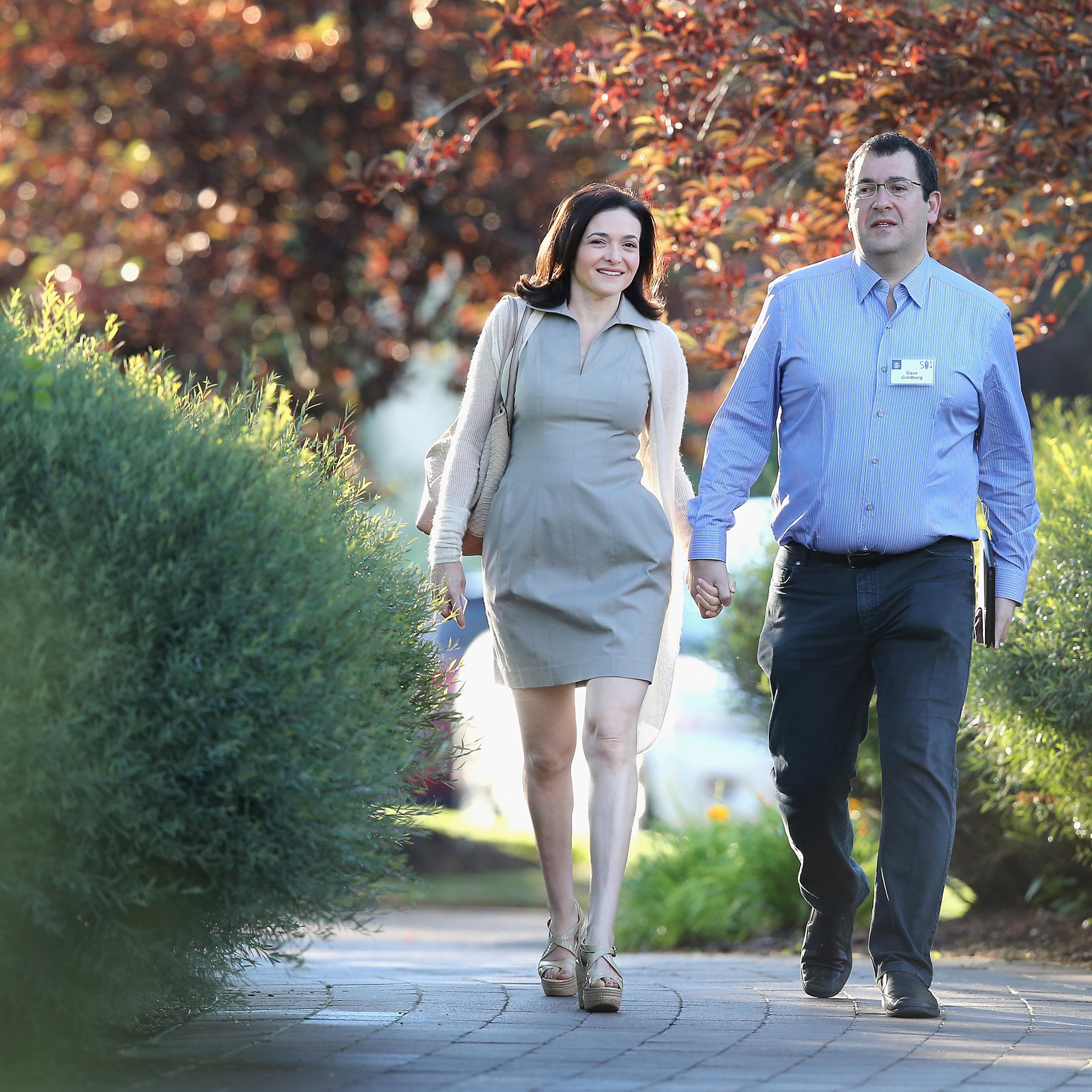 Sheryl Sandberg, chief operating officer (COO) of Facebook, and her husband David Goldberg, CEO of SurveyMonkey, attend the Allen & Company Sun Valley Conference on July 9, 2014 in Sun Valley, Idaho.