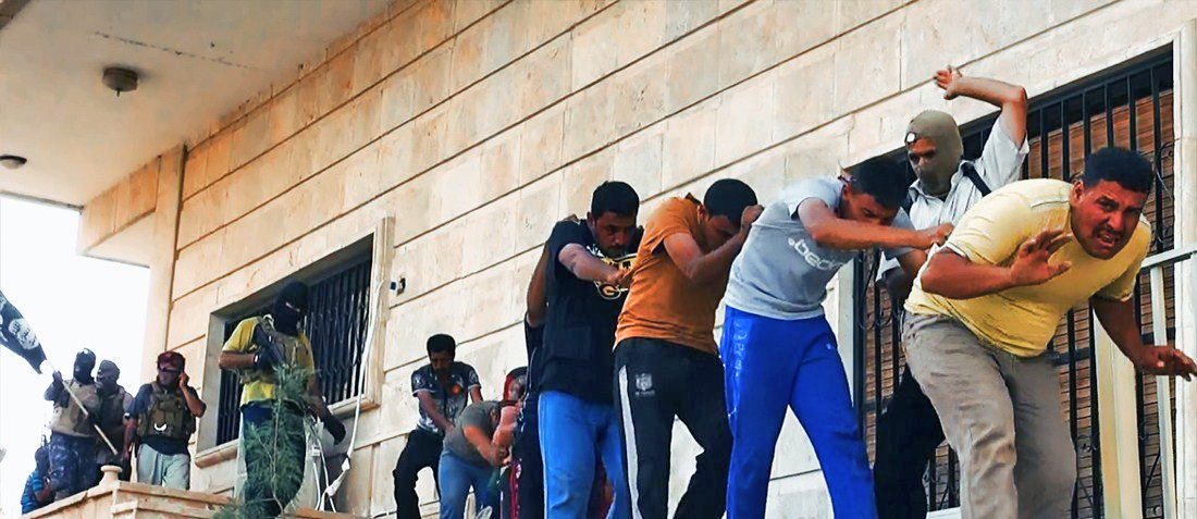 An image uploaded on June 14, 2014 on the jihadist website Welayat Salahuddin allegedly shows militants of ISIS capturing dozens of Iraqi security forces members prior to transporting them to an unknown location in the Salaheddin province ahead of execut