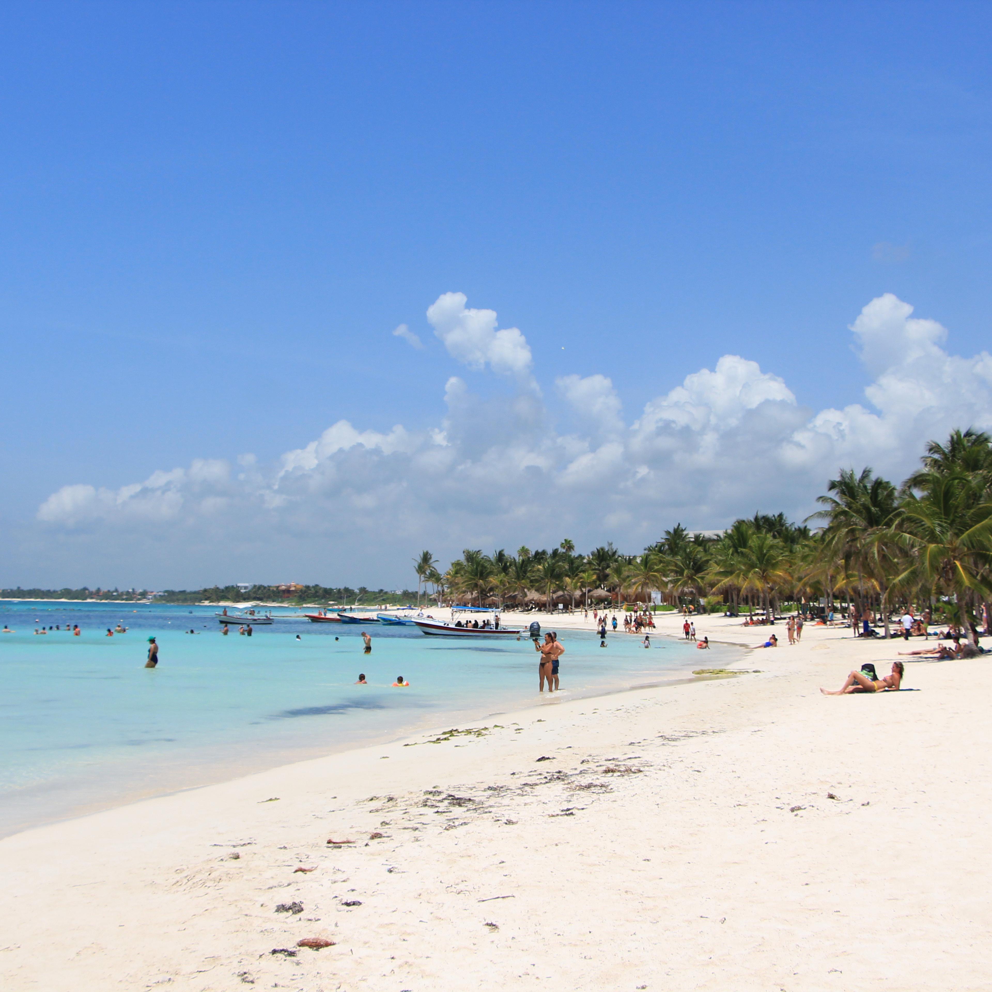 Scenic View Of Beach Against Blue Sky