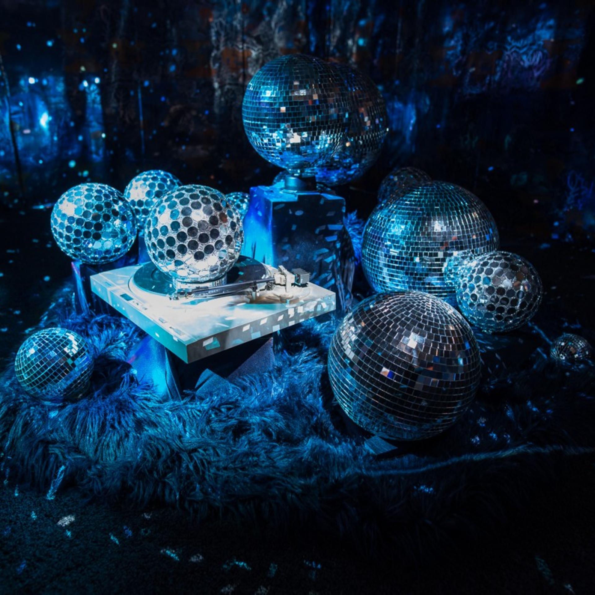 Cauleen Smith, Space Station: Two Rebeccas, 2018. Wallpaper, disco balls, turntable, motor, fur, shag carpet, two projectors, digital video. LACMA