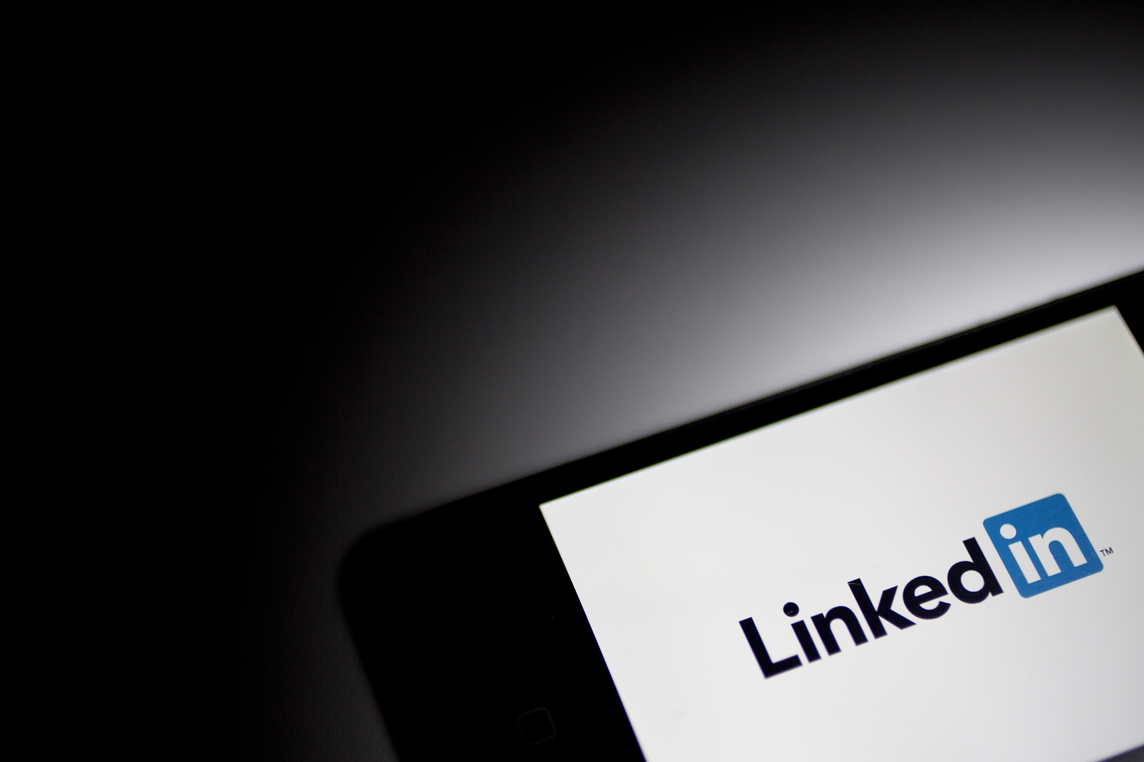 The LinkedIn logo displayed on a phone.