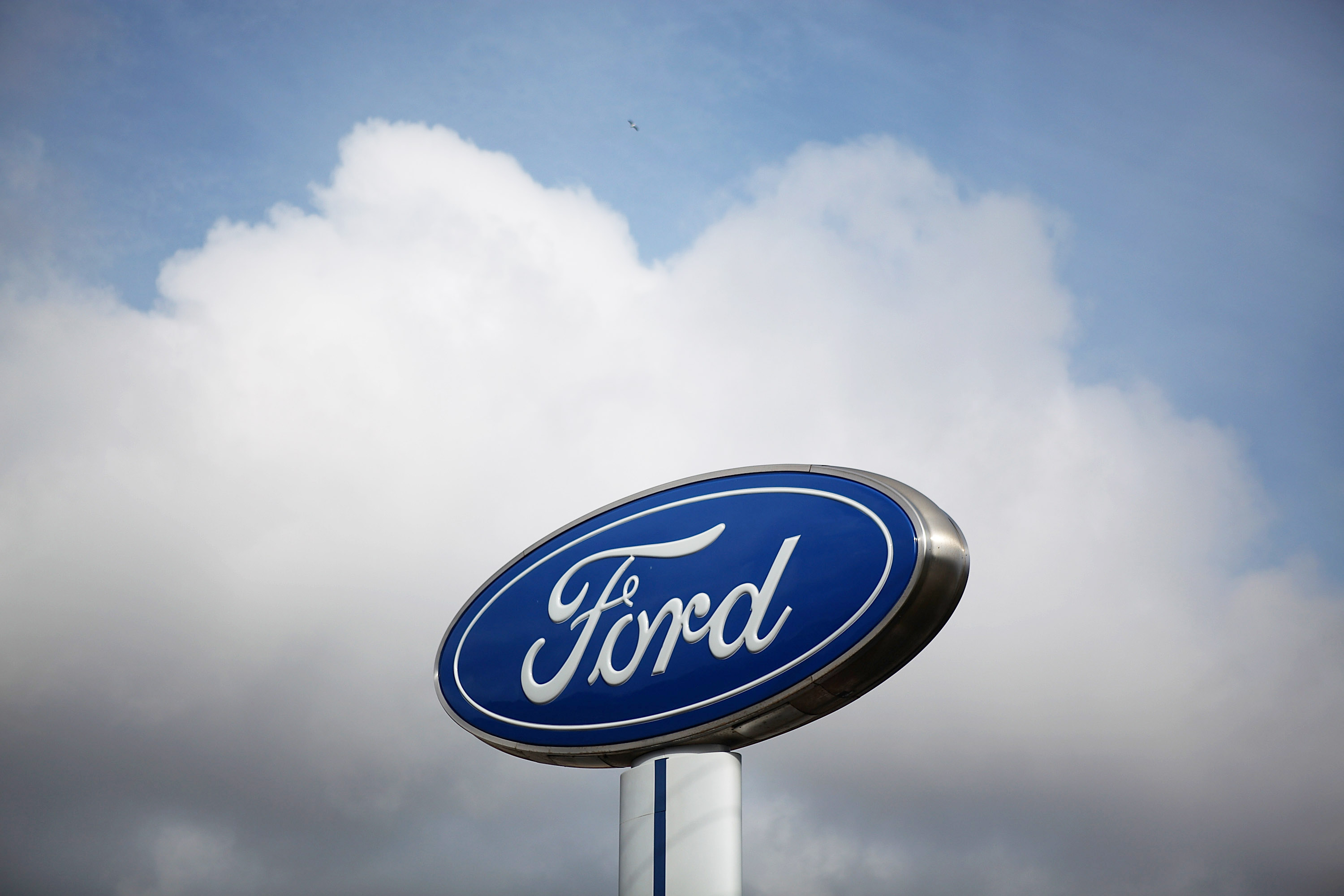 The Ford logo is displayed in front of Serramonte Ford in Colma, Calif. on Feb. 23, 2011.