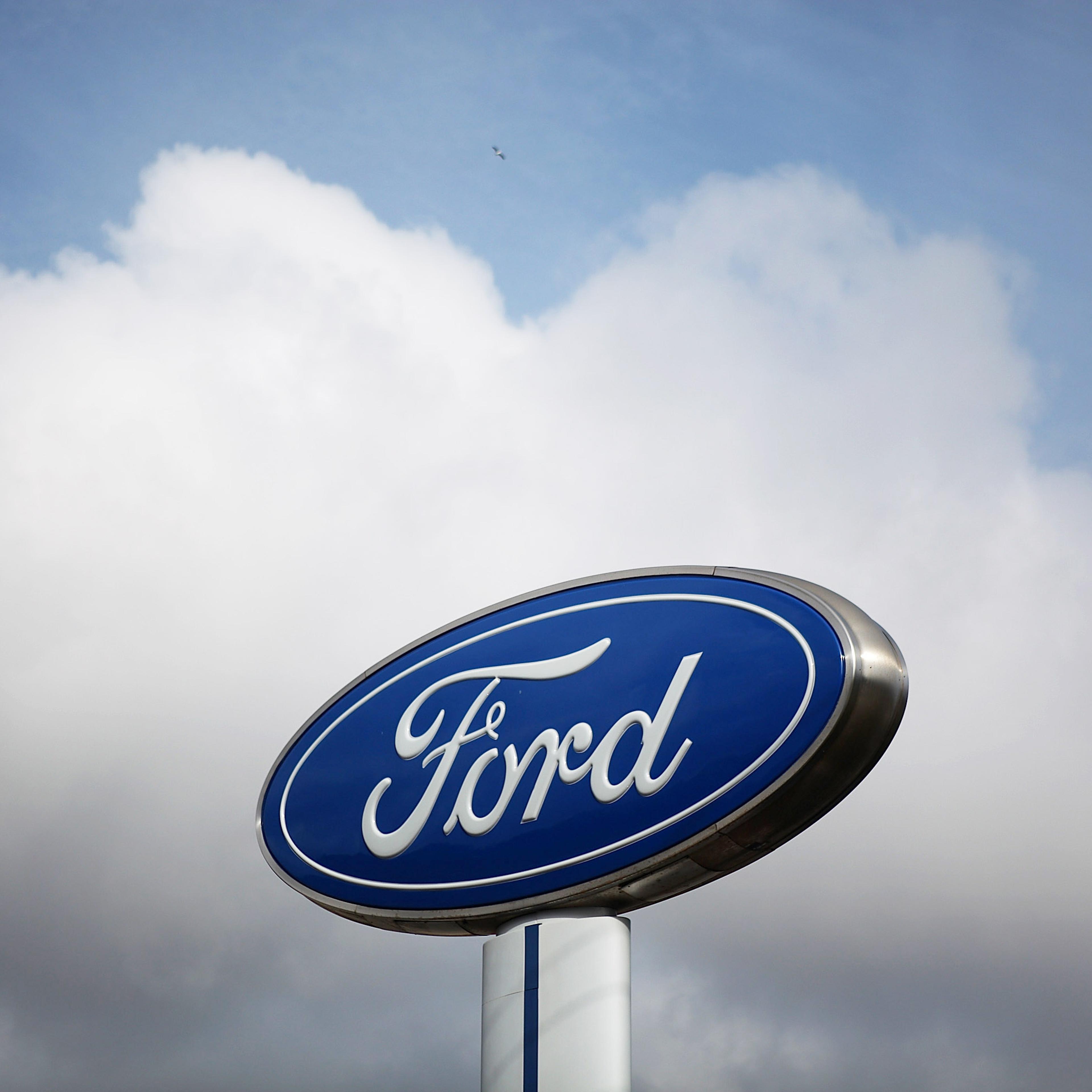 The Ford logo is displayed in front of Serramonte Ford in Colma, Calif. on Feb. 23, 2011.