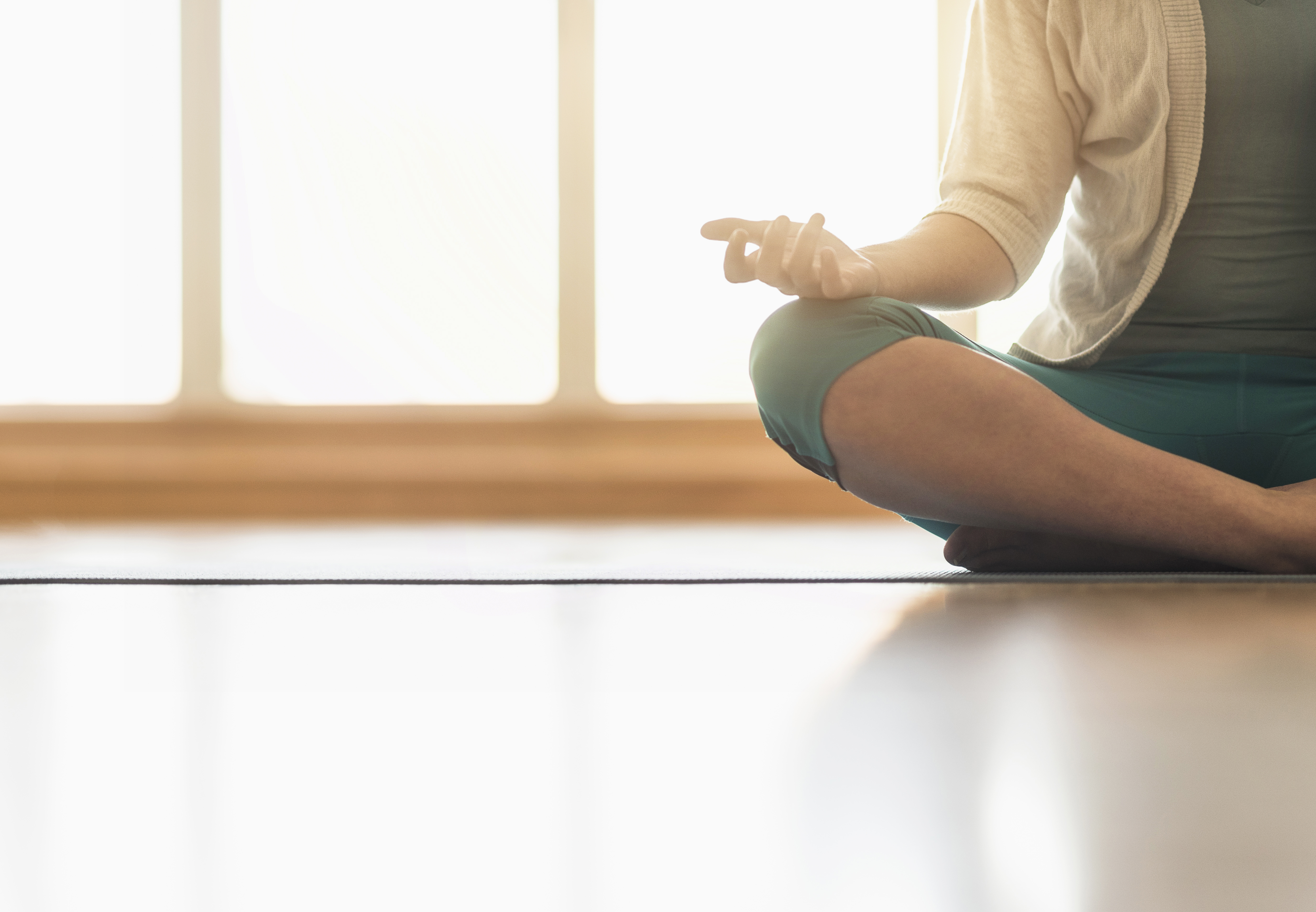 Woman meditating on floor