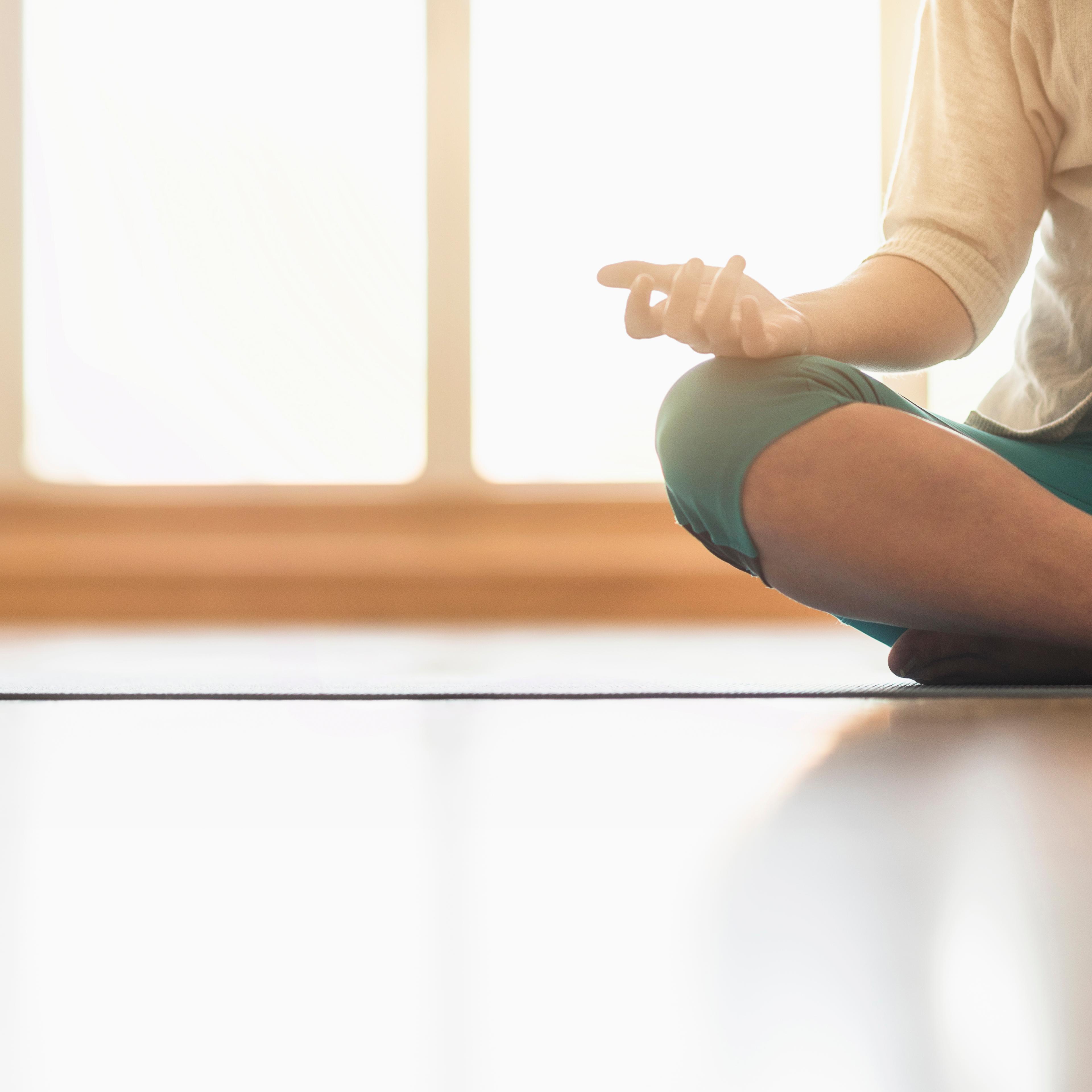 Woman meditating on floor