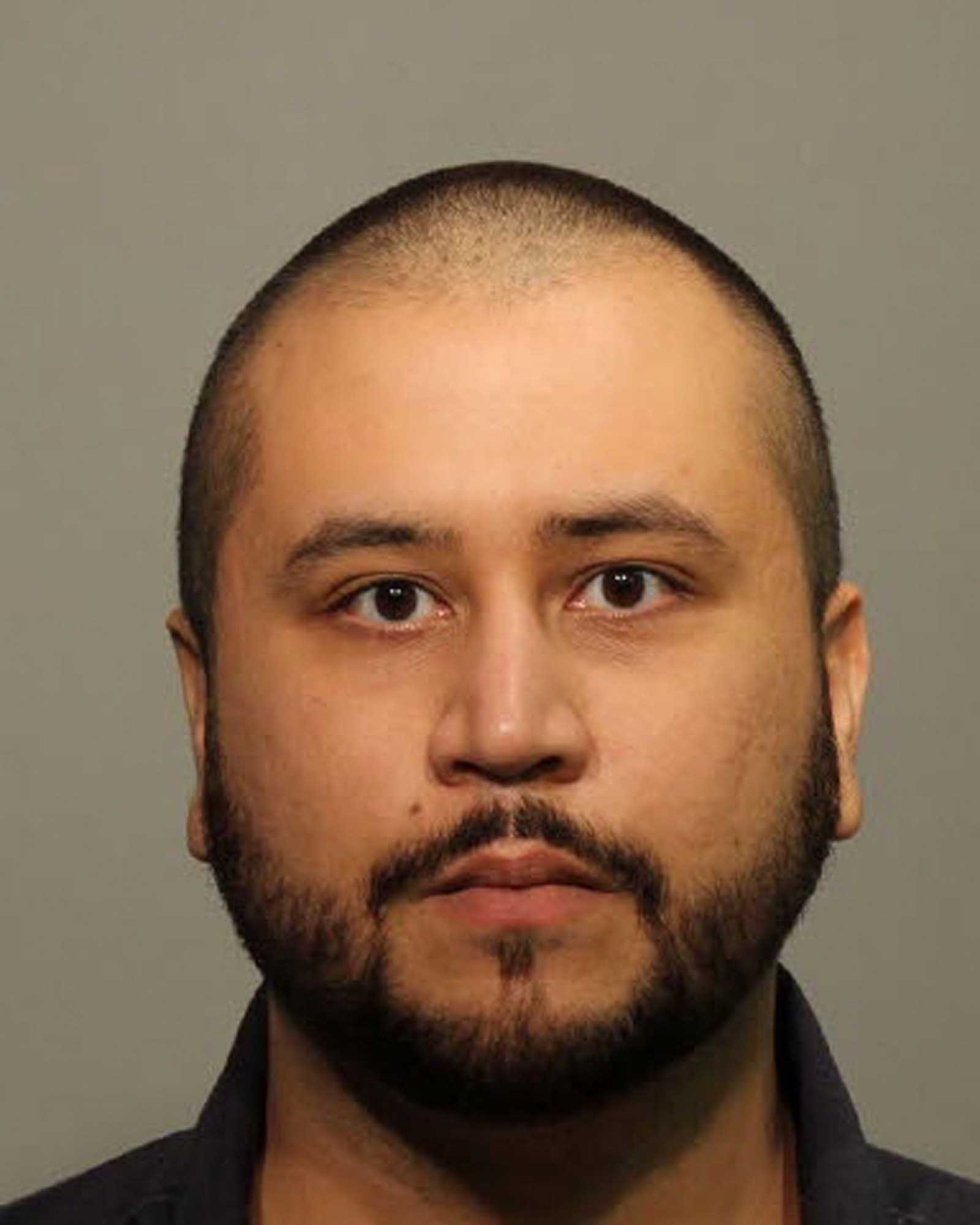 In this handout photo provided by Seminole County Sheriff`s Office, George Zimmerman poses for a mug shot photo after being arrested and booked into jail at the John Polk Correctional Facility in Sanford, Florida on Jan 9, 2015.