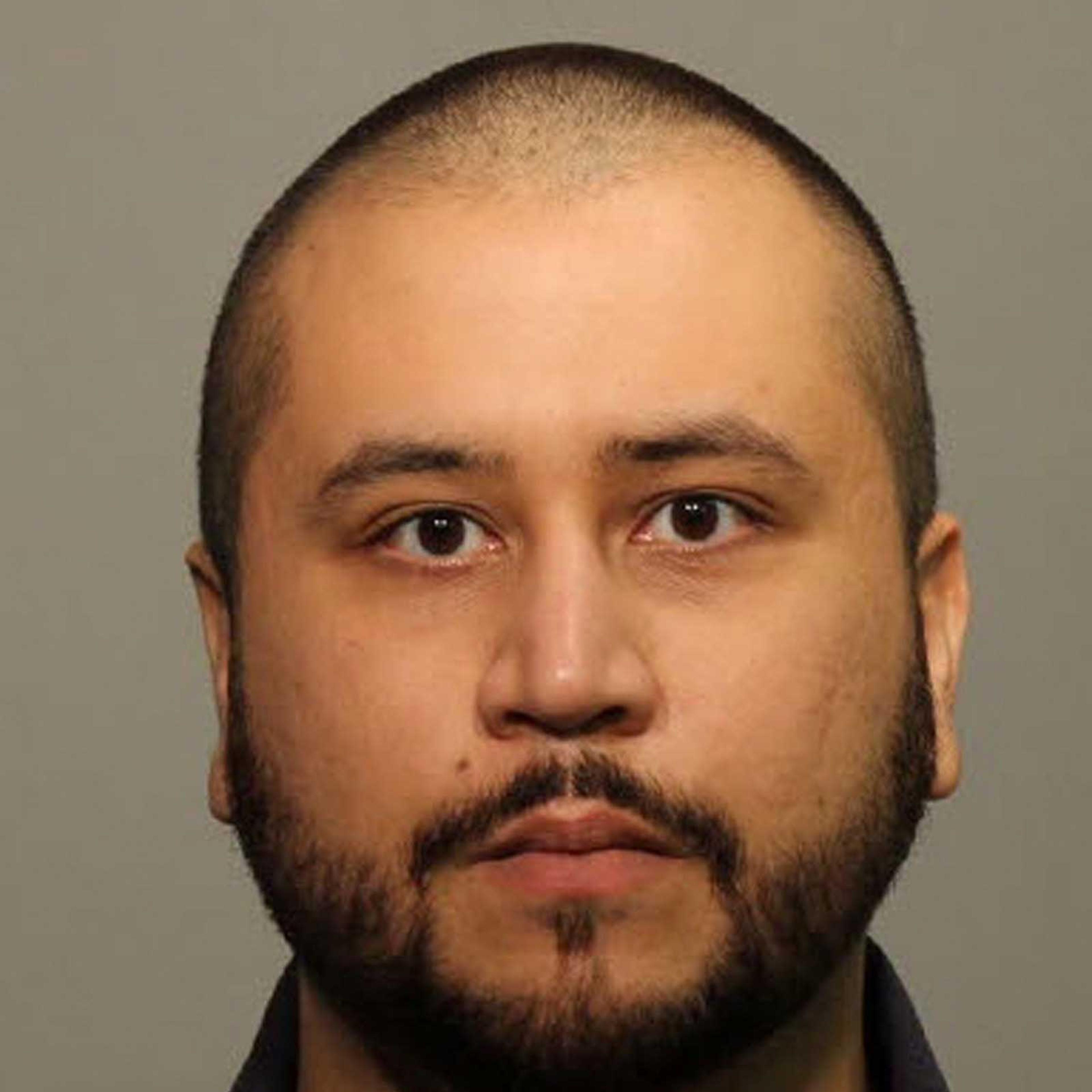 In this handout photo provided by Seminole County Sheriff`s Office, George Zimmerman poses for a mug shot photo after being arrested and booked into jail at the John Polk Correctional Facility in Sanford, Florida on Jan 9, 2015.
