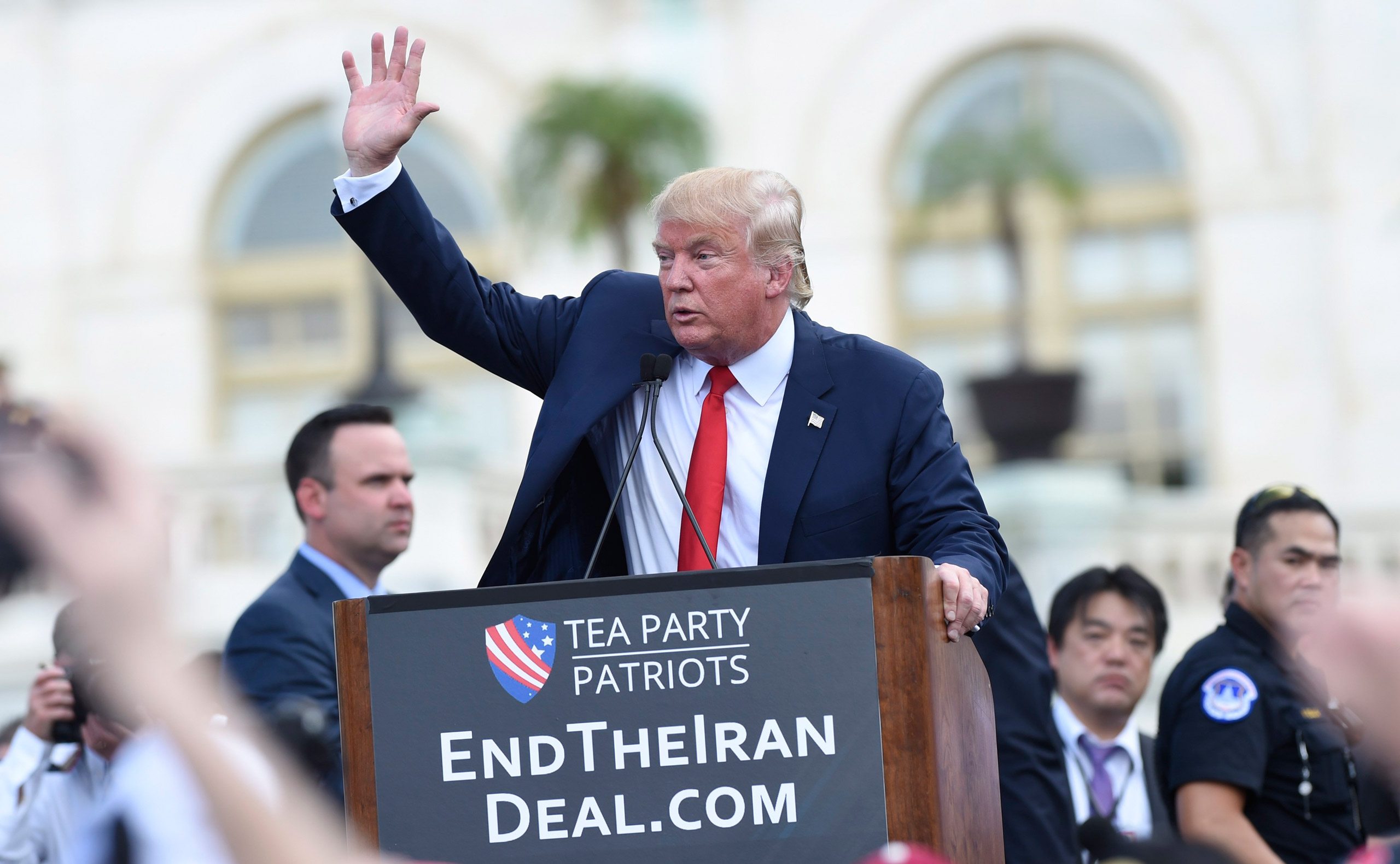 Republican presidential candidate Donald Trump waves to the crowd after speaking during a rally opposing the Iran nuclear deal outside the Capitol in Washington, Wednesday, Sept. 9, 2015. (AP Photo/Susan Walsh)