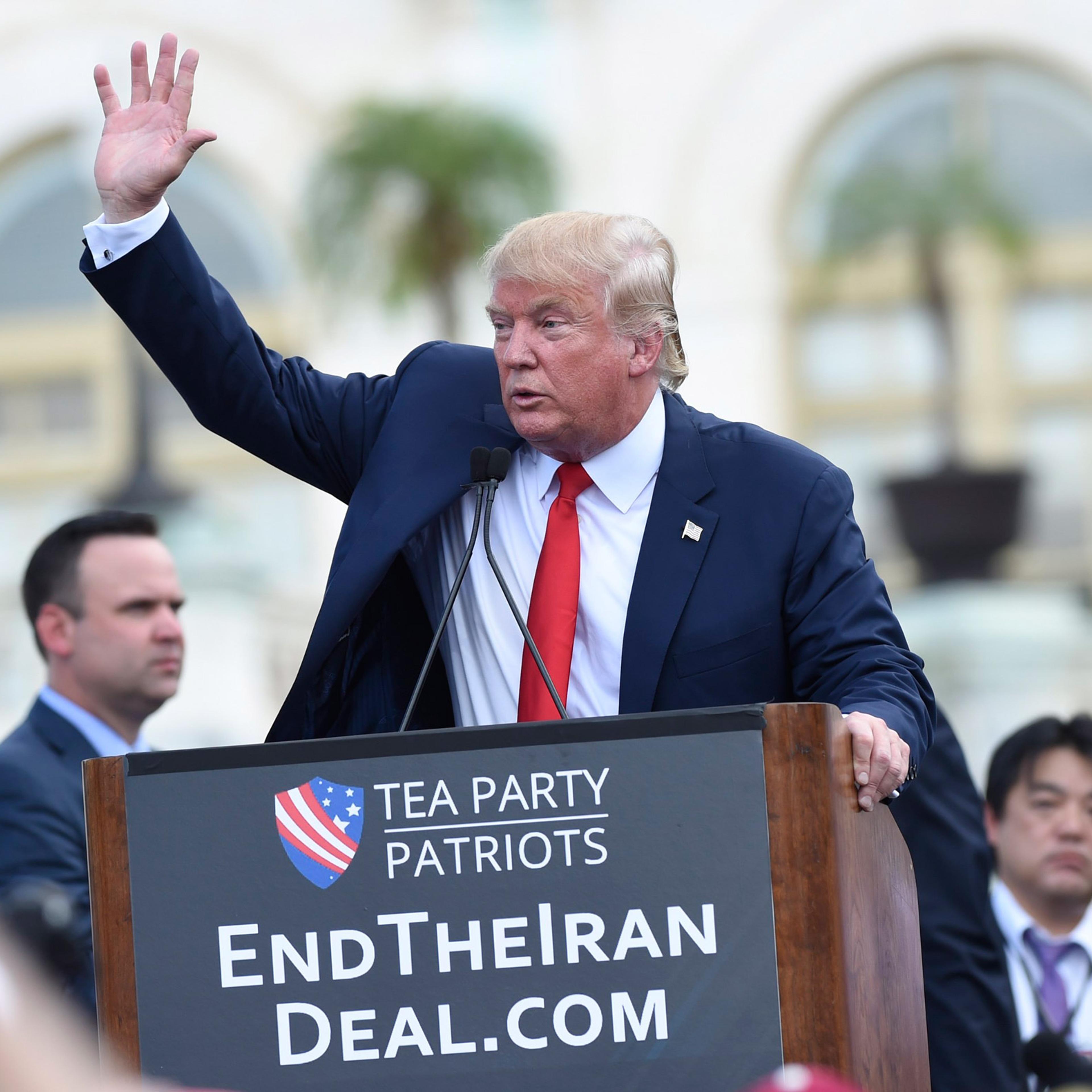 Republican presidential candidate Donald Trump waves to the crowd after speaking during a rally opposing the Iran nuclear deal outside the Capitol in Washington, Wednesday, Sept. 9, 2015. (AP Photo/Susan Walsh)