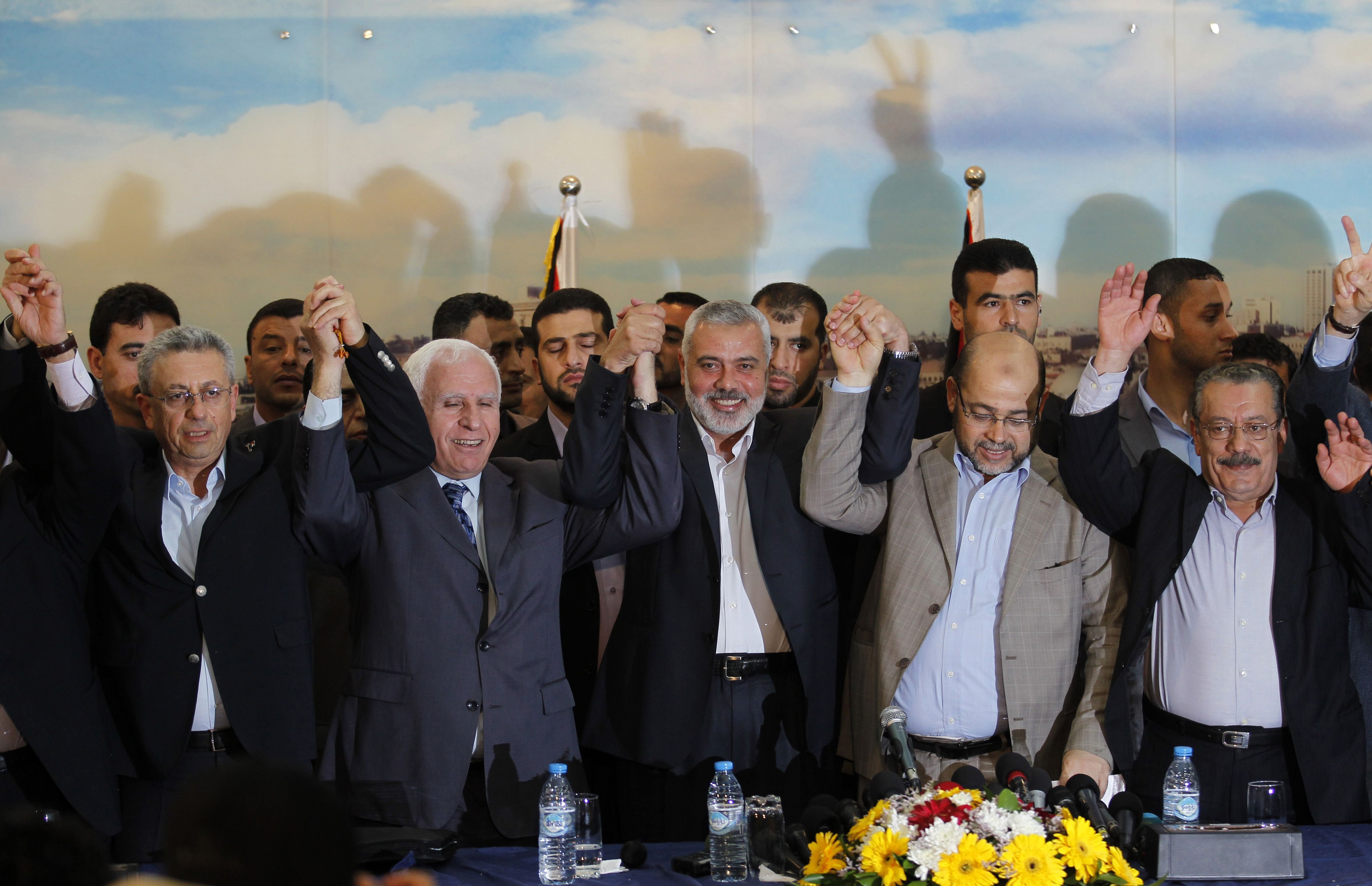 From left: Palestinian legislator Mustafa Barghouti, Palestinian Fatah delegation chief Azzam al-Ahmed, Hamas prime minister in the Gaza Strip Ismail Haniya, Hamas deputy leader Musa Abu Marzuk, and secretary-general of the Palestinian Arab Front (PAF) J