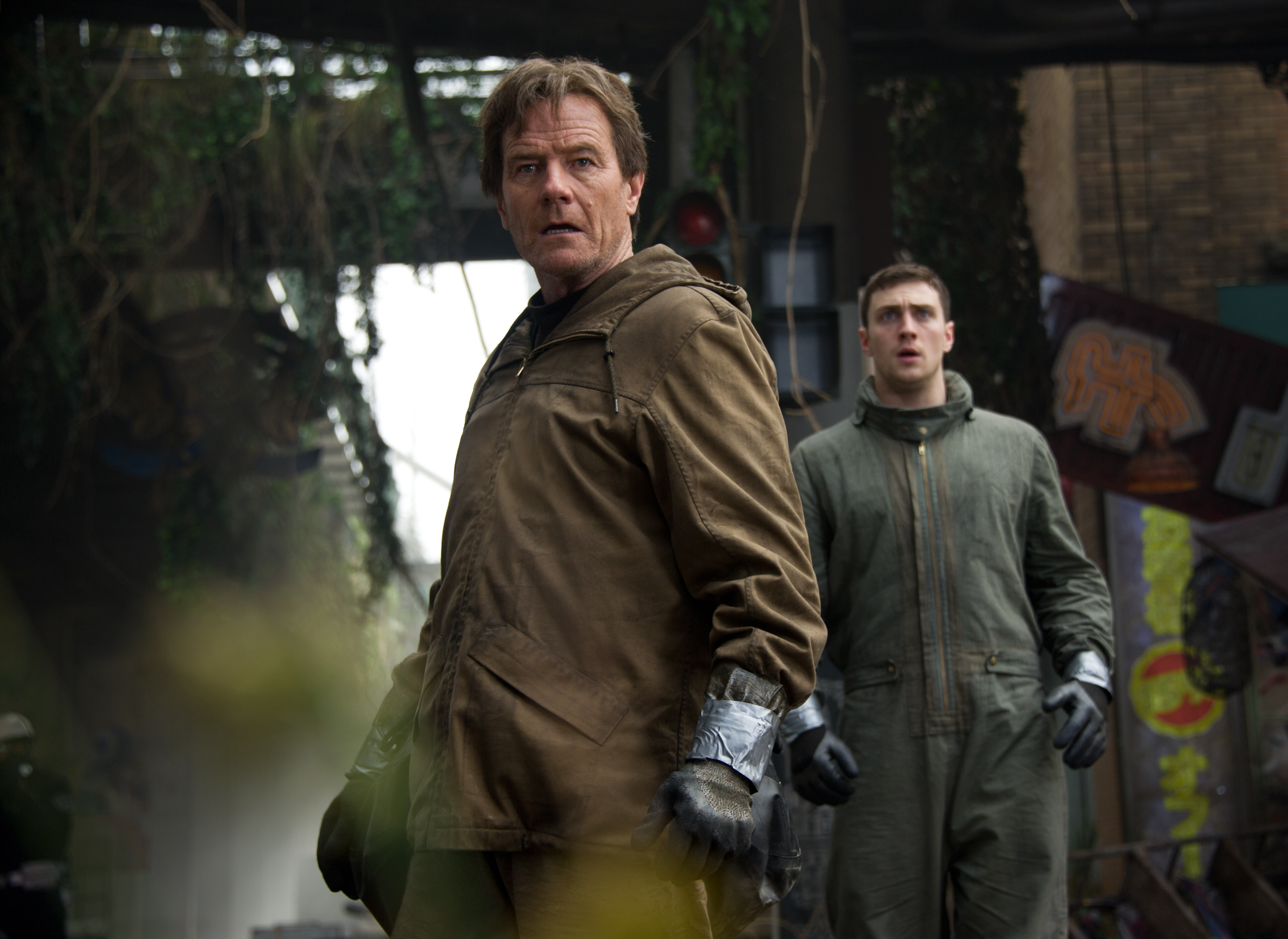 From left: Bryan Cranston and Aaron Taylor Johnson in Godzilla.