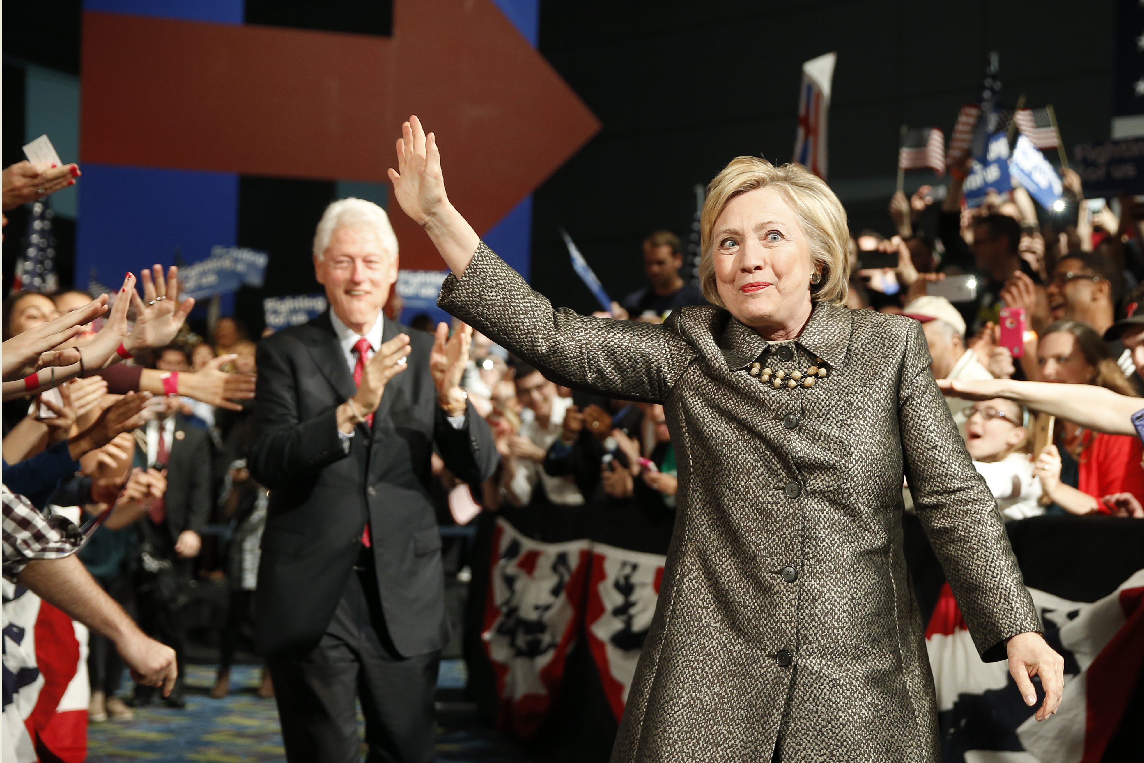 Democratic presidential candidate Hillary Clinton and former President Bill Clinton move to the stage at her presidential primary election night rally on April 26, 2016, in Philadelphia.