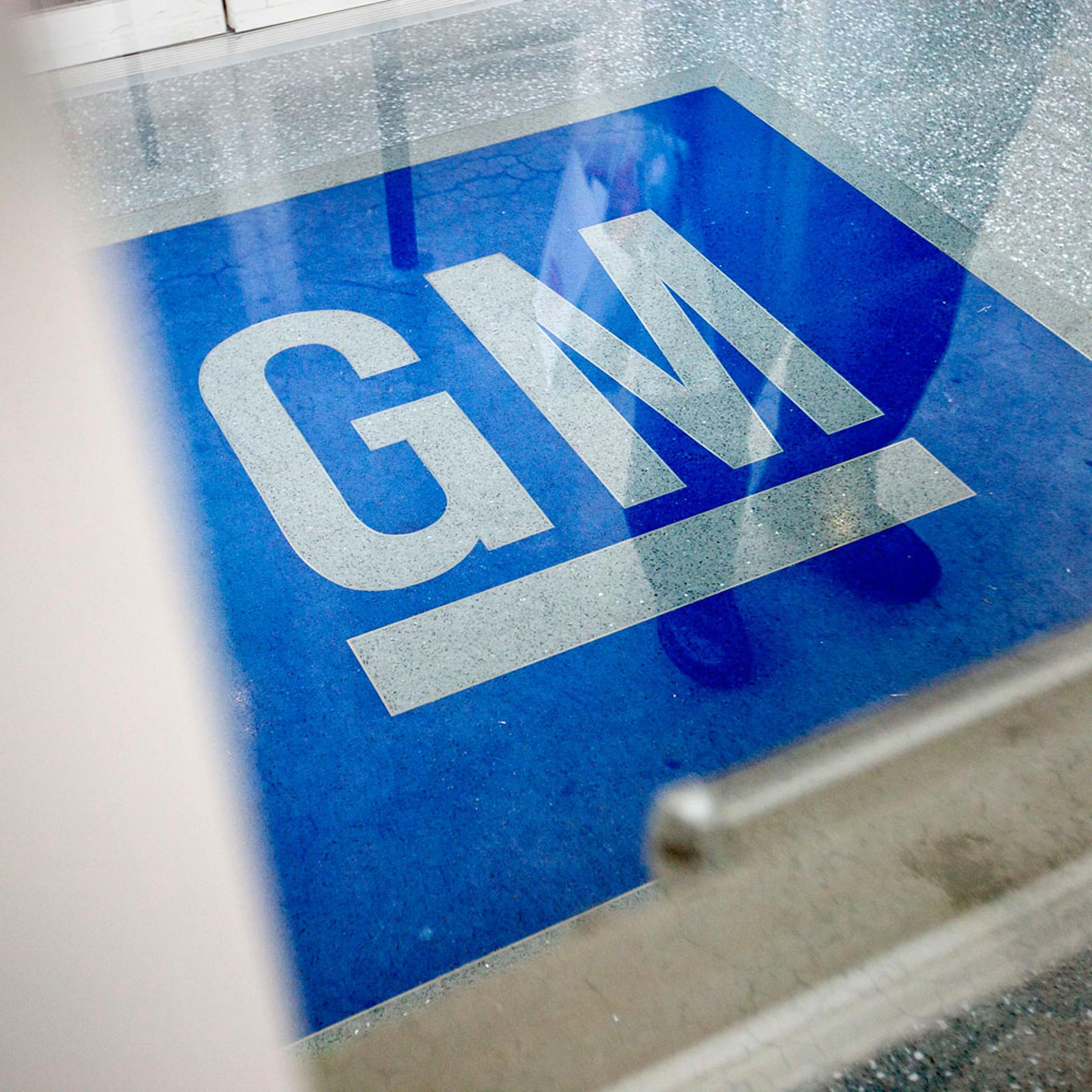 The logo for General Motors at the entrance at the site of a GM information technology center in Roswell, Ga., on Jan. 10, 2013.
