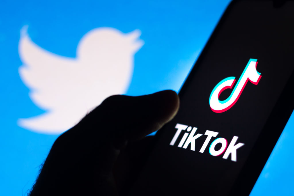 In this photo illustration the TikTok logo seen displayed on