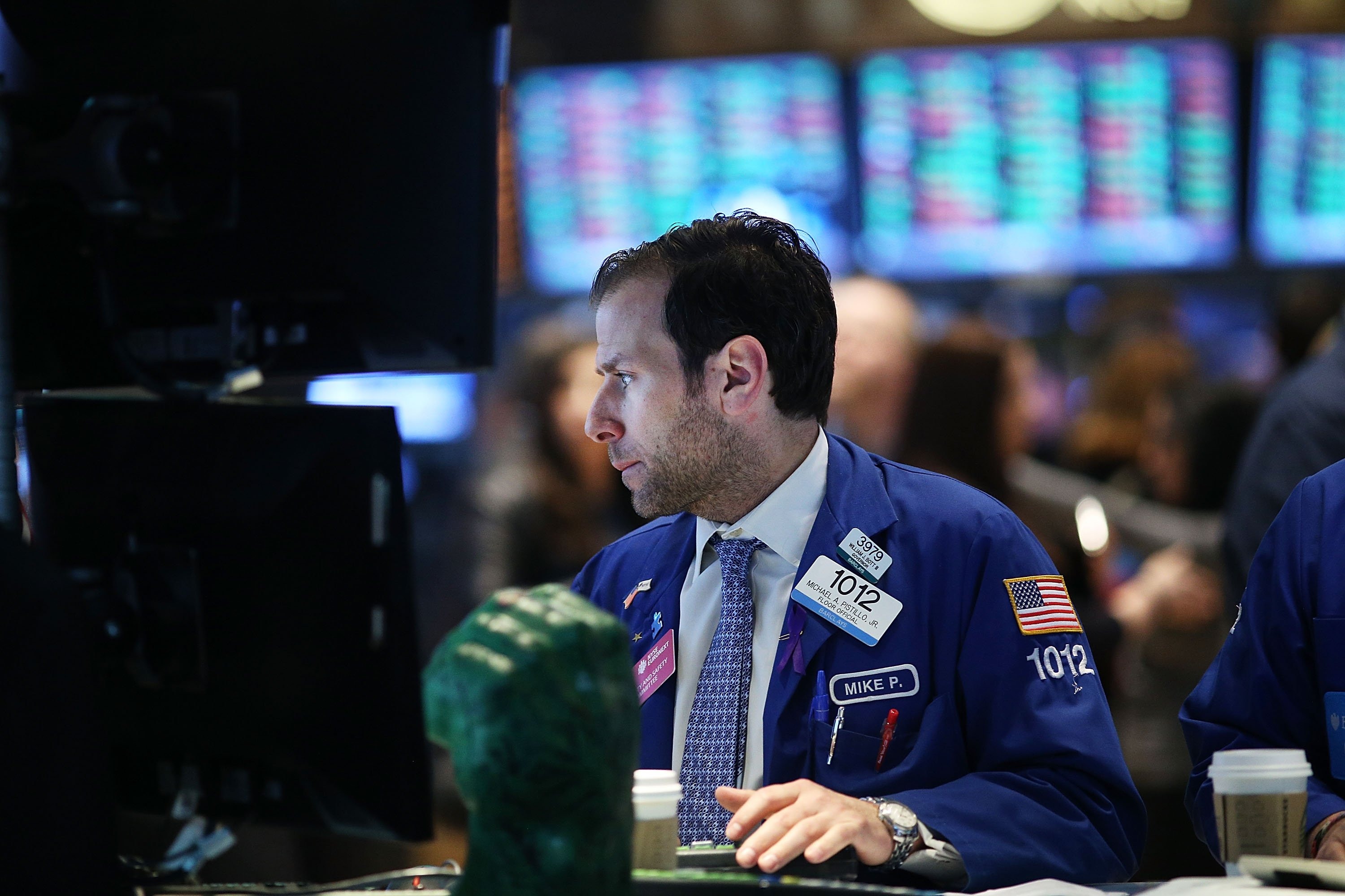 Traders work on the floor of the New York Stock Exchange after the ringing the Opening Bell on April 1, 2014 in New York City.