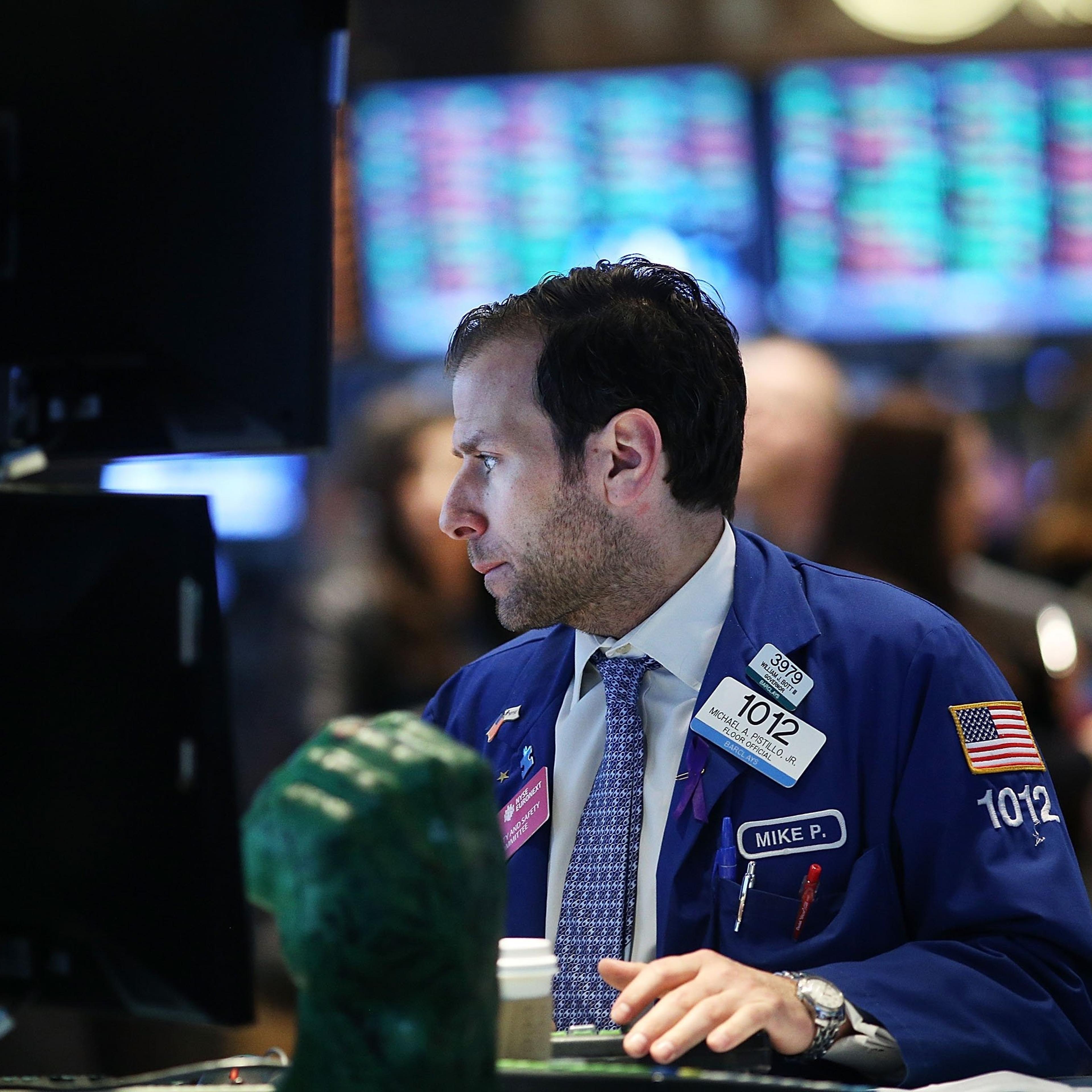 Traders work on the floor of the New York Stock Exchange after the ringing the Opening Bell on April 1, 2014 in New York City.