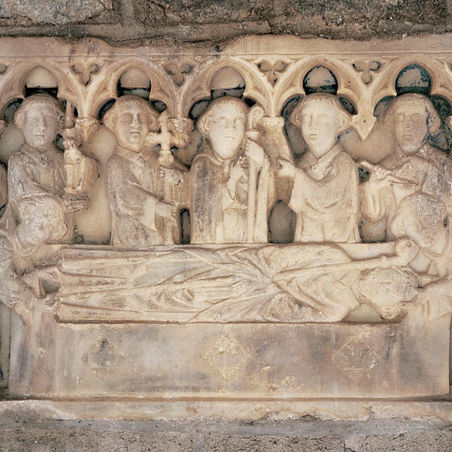 Martin-du-Canigou. Tombstone. Reliefs represent: The funeral procession. 14th century. Cloister of the Monastery. Gothic style. France.