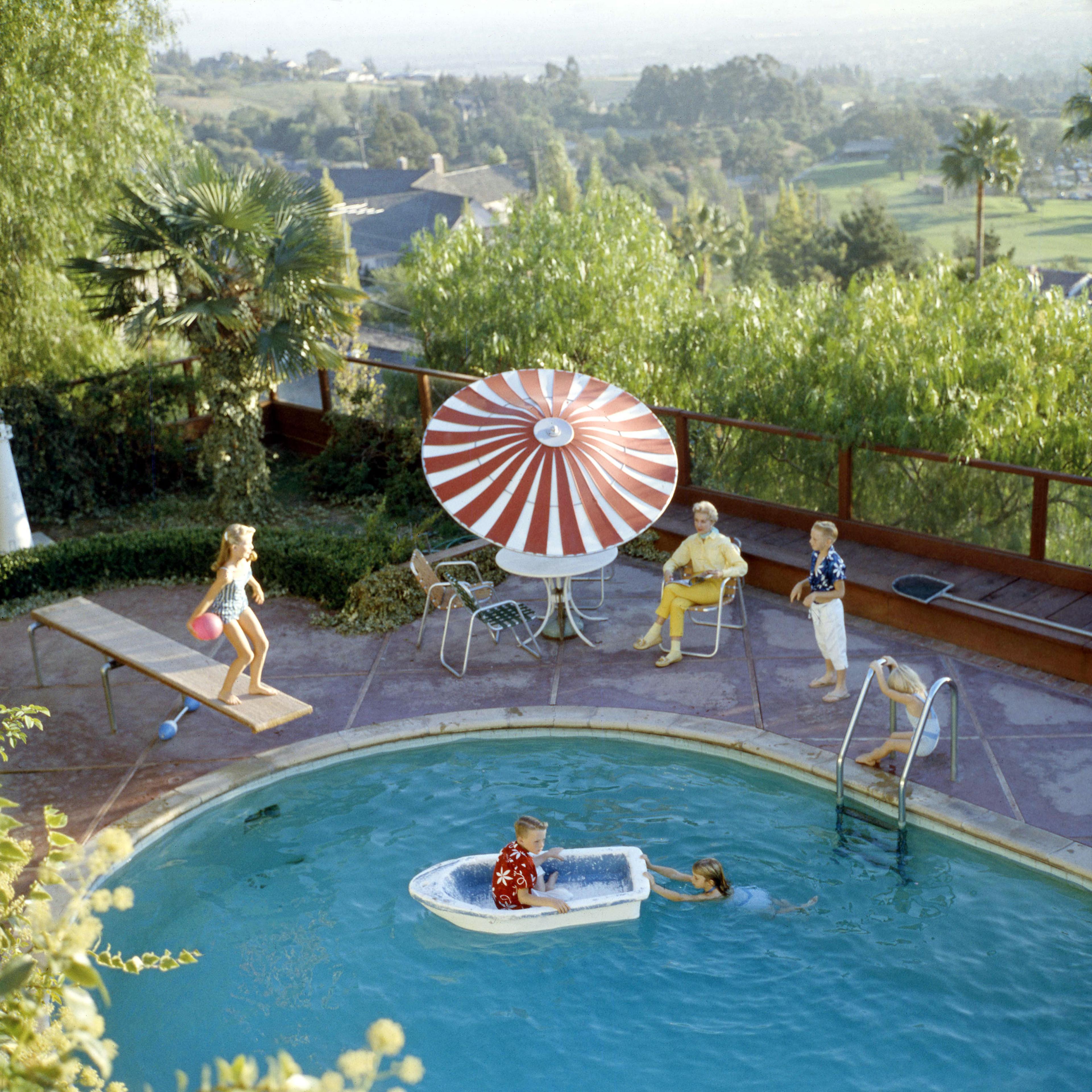 Color photographs of backyard pools in 1960.