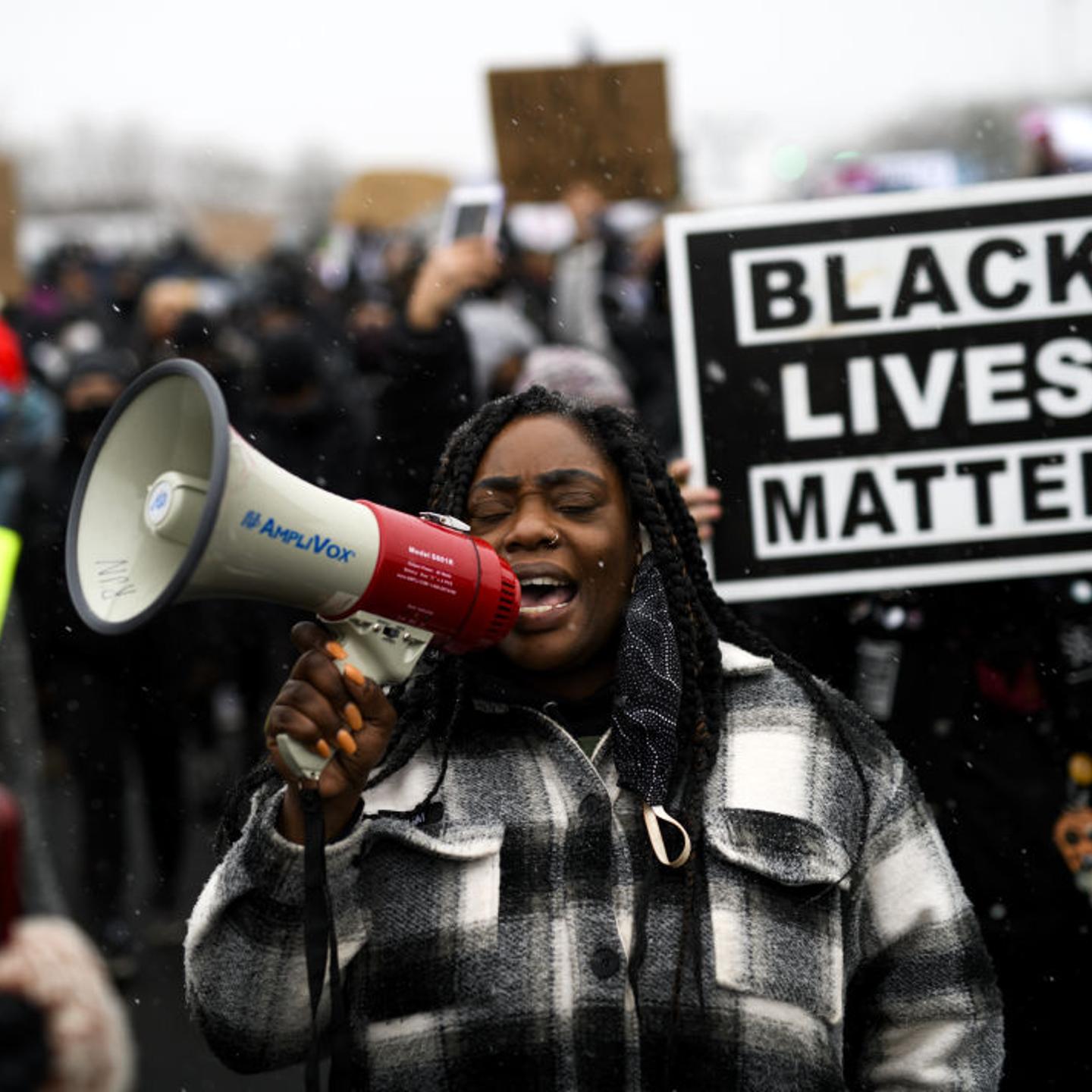 Protesters march outside the Brooklyn Center police headquarters on April 13, 2021 in Brooklyn Center, Minnesota