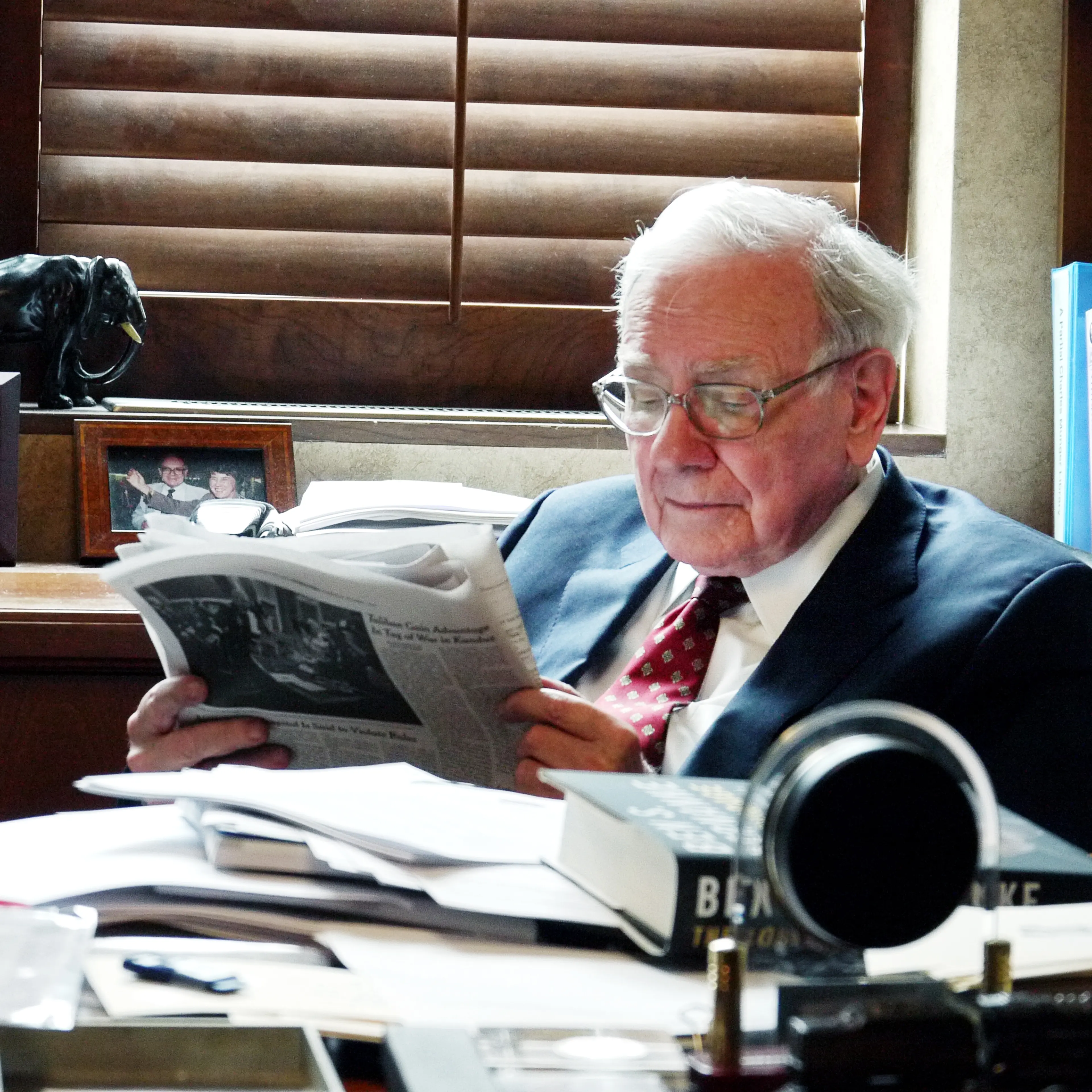 Warren Buffett in his Berkshire Hathaway office in Omaha, Nebraska. He has been known to read six national and local newspapers a day, TIME magazine reported in its July 6, 2015, issue.