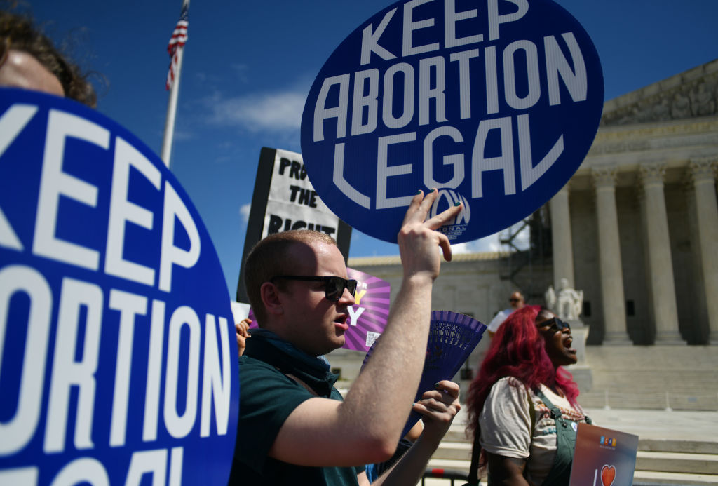 WASHINGTON, D.C., APRIL 15: Activists gather at the US Supreme