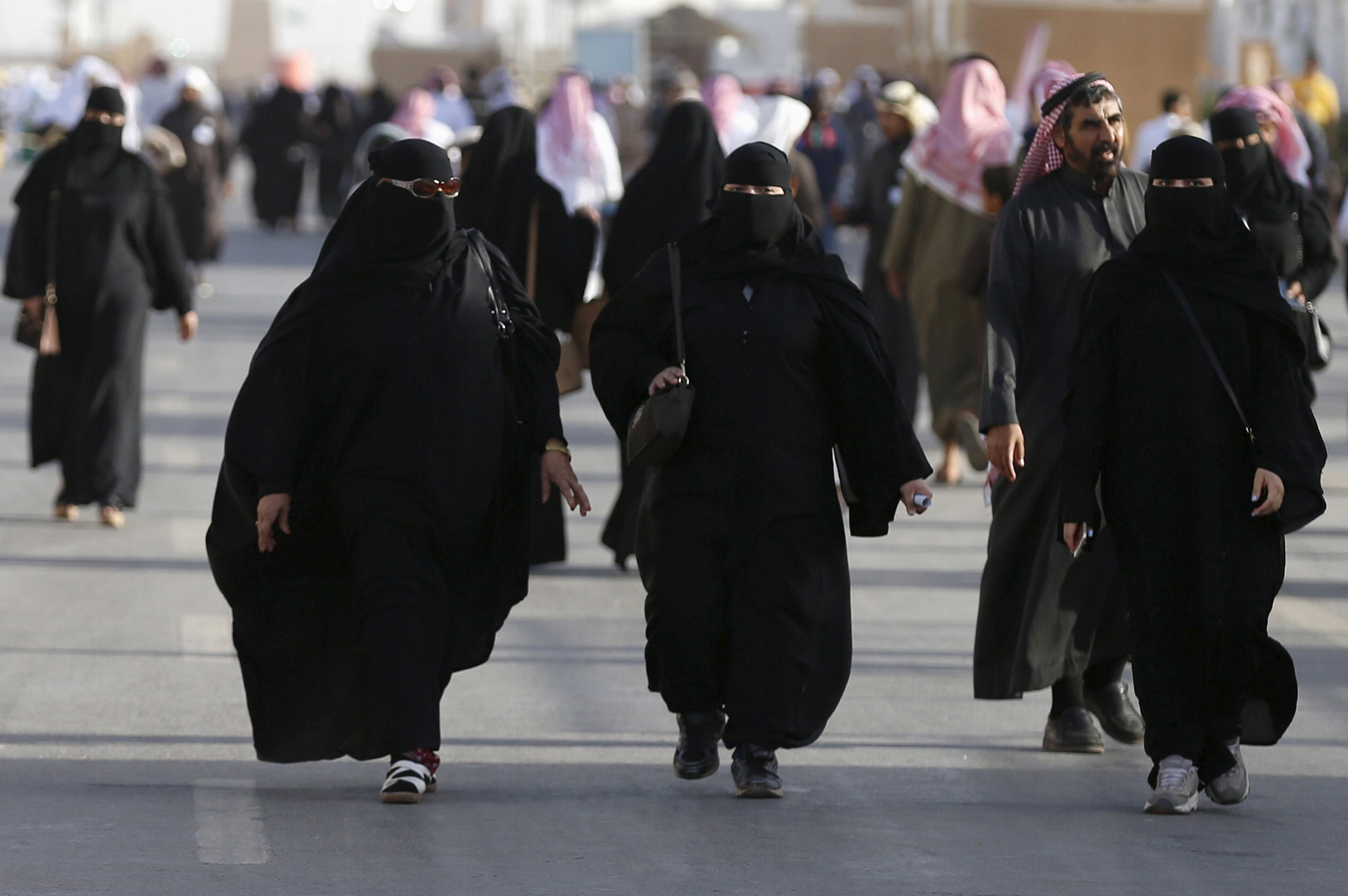 Saudi women walk on the outskirts of Riyadh, Saudi Arabia on Feb. 8, 2016.