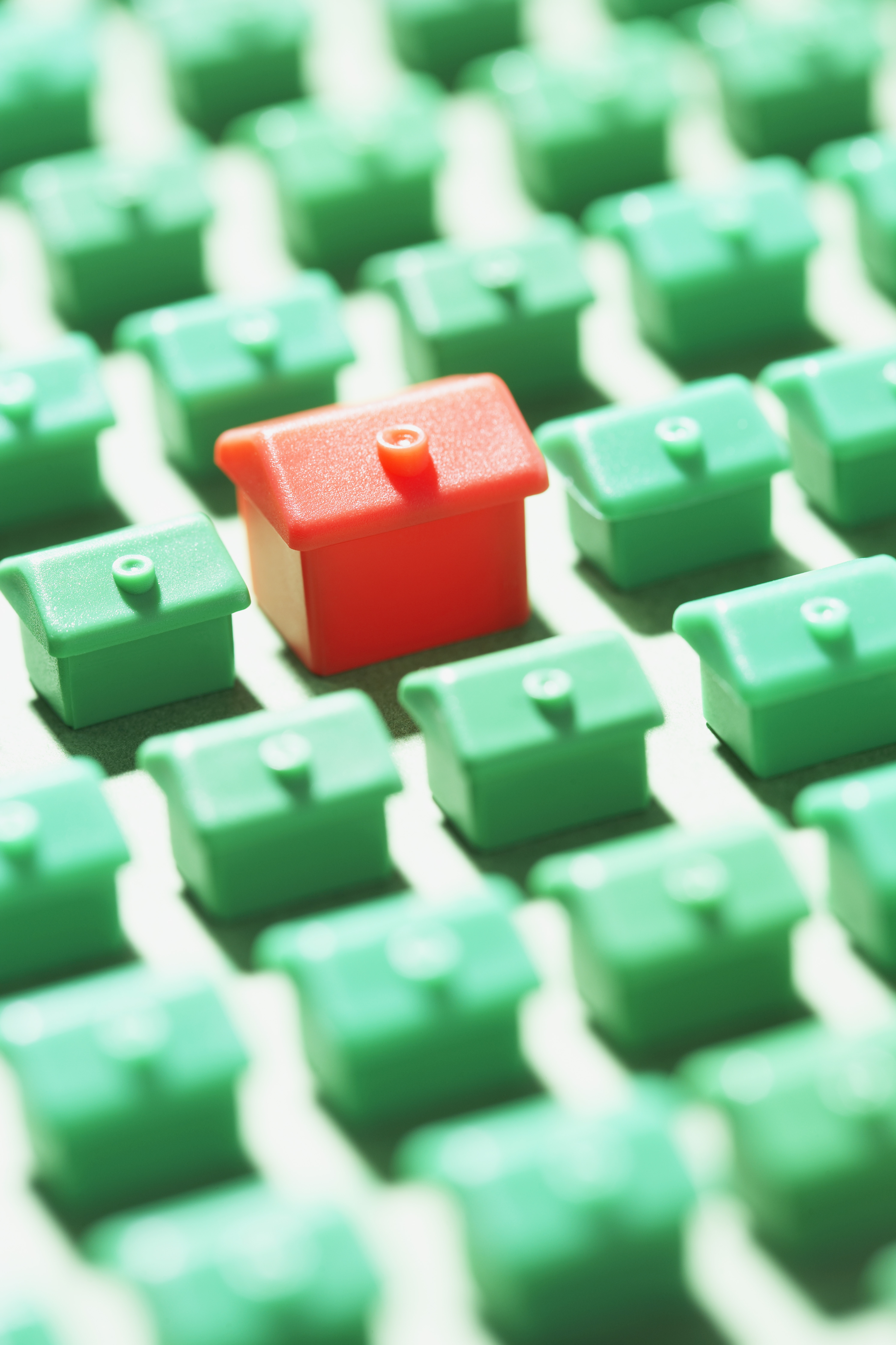 many-green-houses-large-red-house