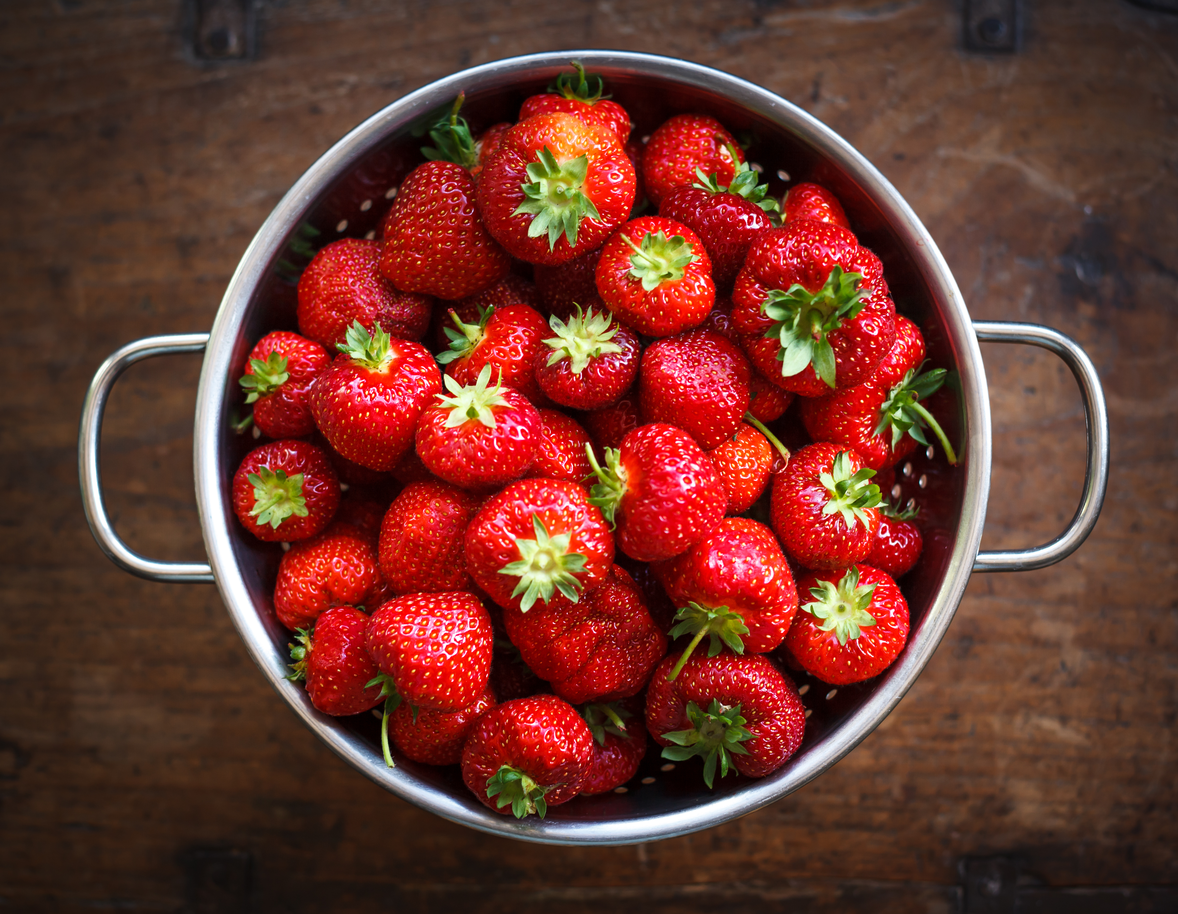 Colander full of ripe strawberries