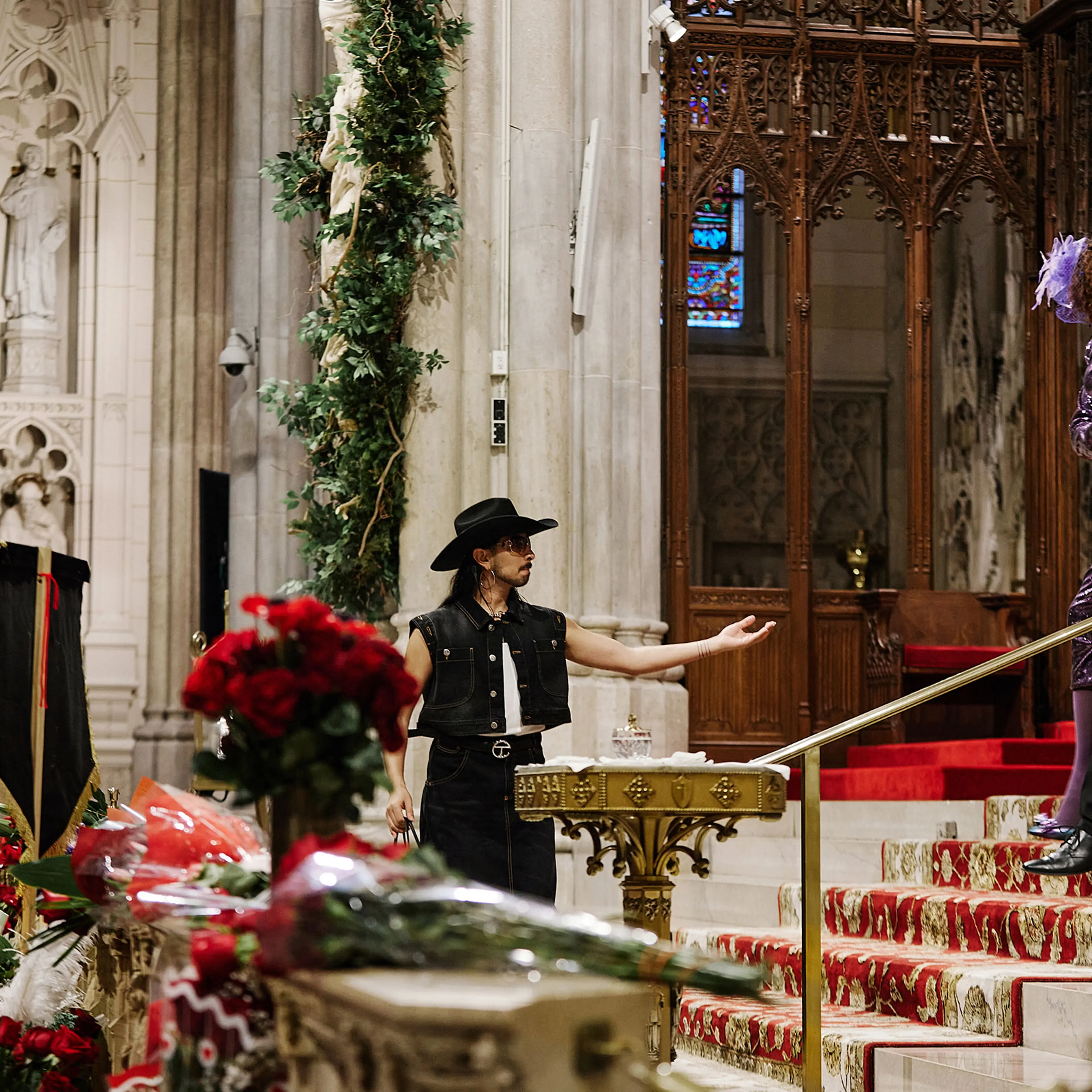 Oscar Diaz reaches out to Ceyenne Doroshow and Peter Scotto during the funeral services for Cecilia Gentili at St. Patricks Cathedral in New York City, on Feb. 15, 2024.