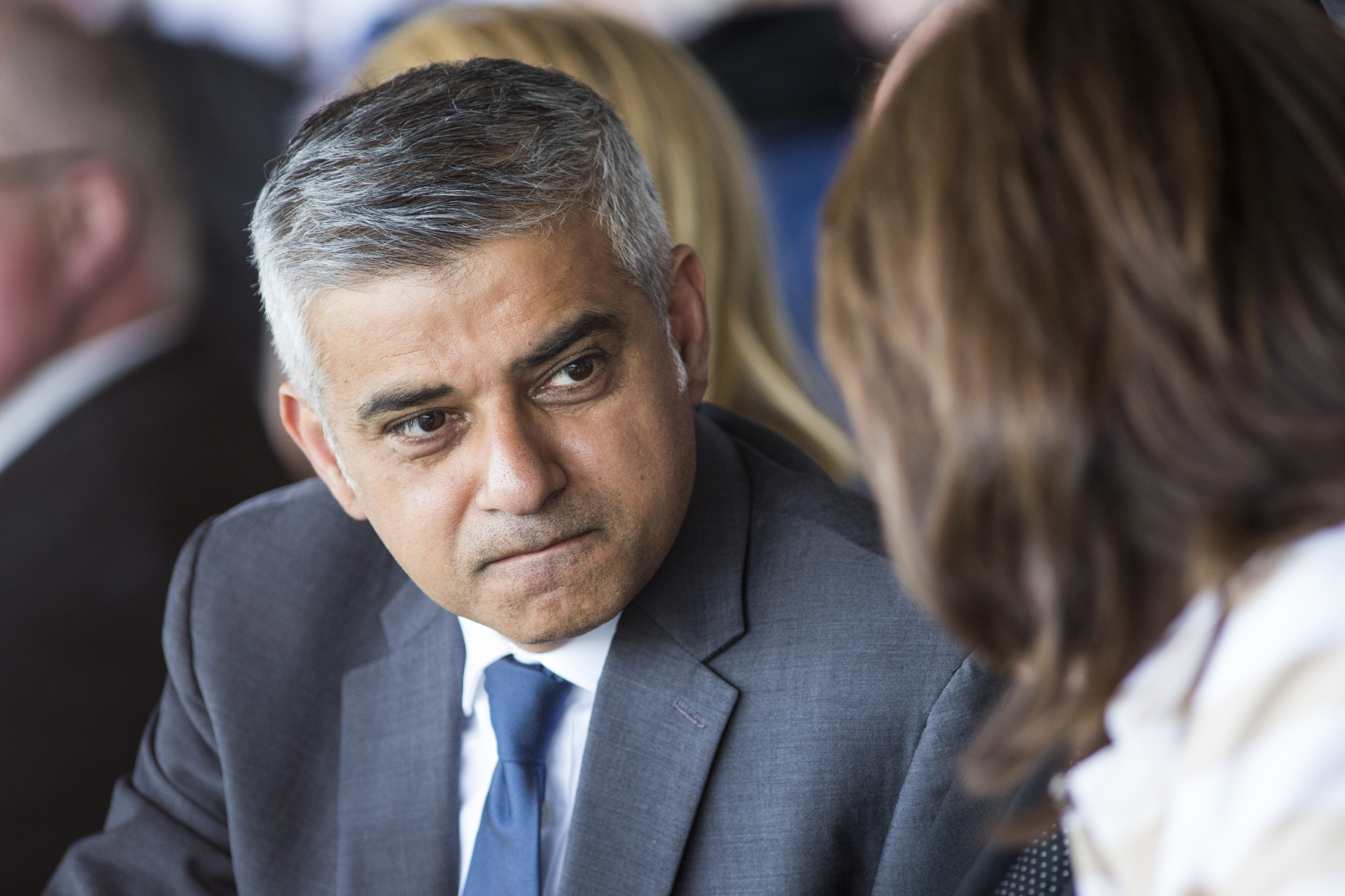 Sadiq Khan speaks with a guest at Yom HaShoah, the Jewish Community's Holocaust Remembrance Day in London on May 8, 2016.
