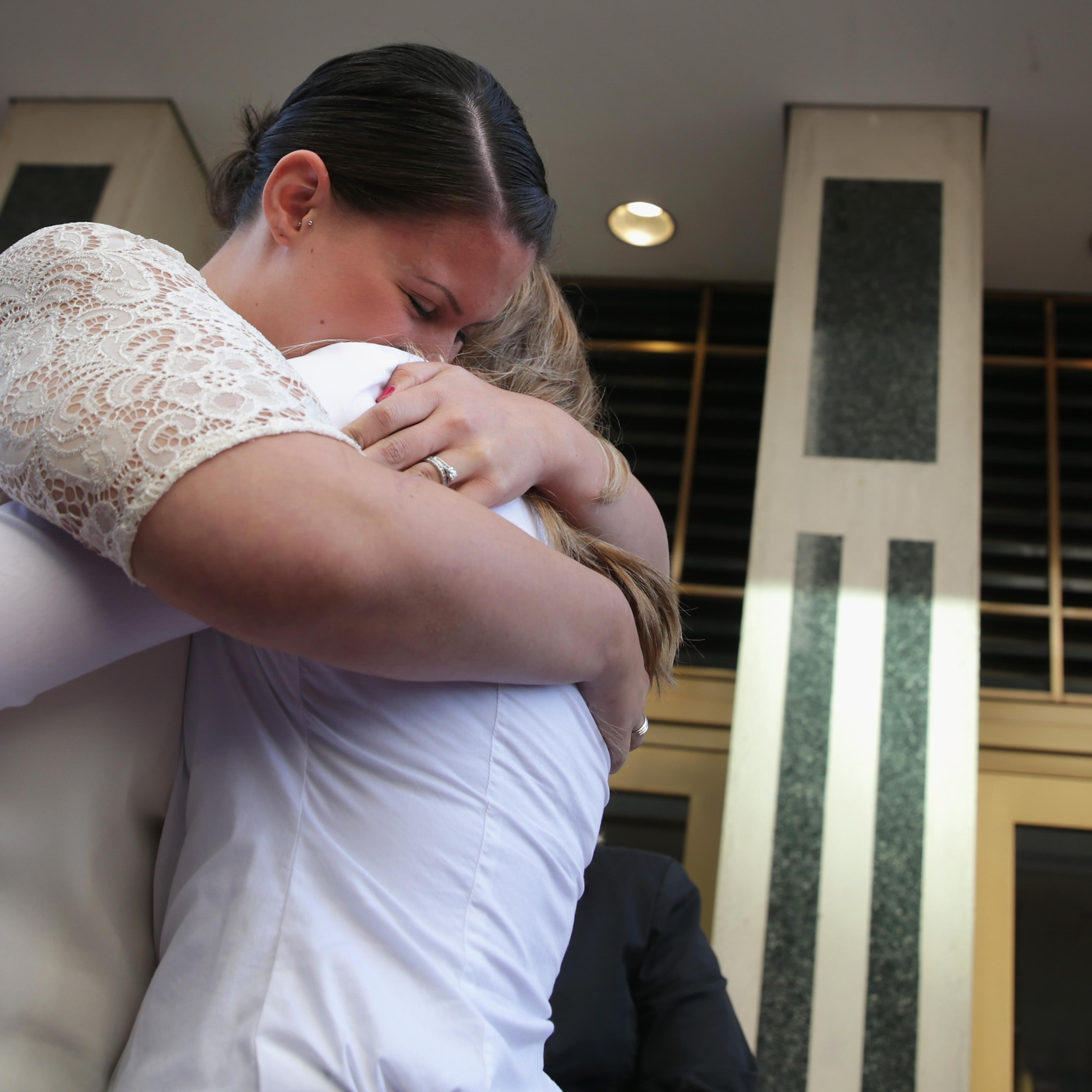 Erika Turner and Jennifer Melsop of Centreville, Virginia, embrace each other after they became the first same sex marriage couple in Arlington County at the Arlington County Courthouse on Oct. 6, 2014 in Arlington, Virginia.