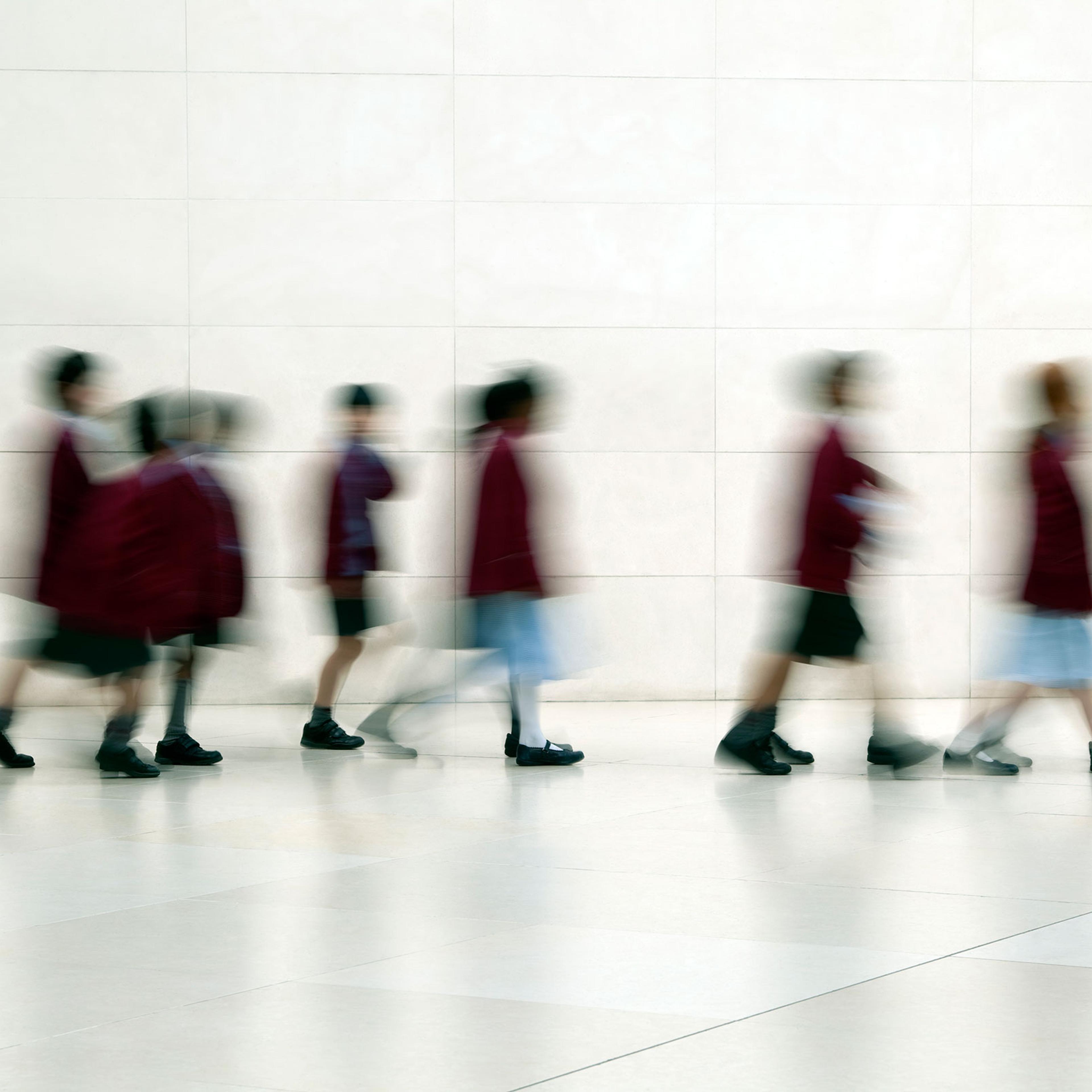 School Children Walking in Corridor