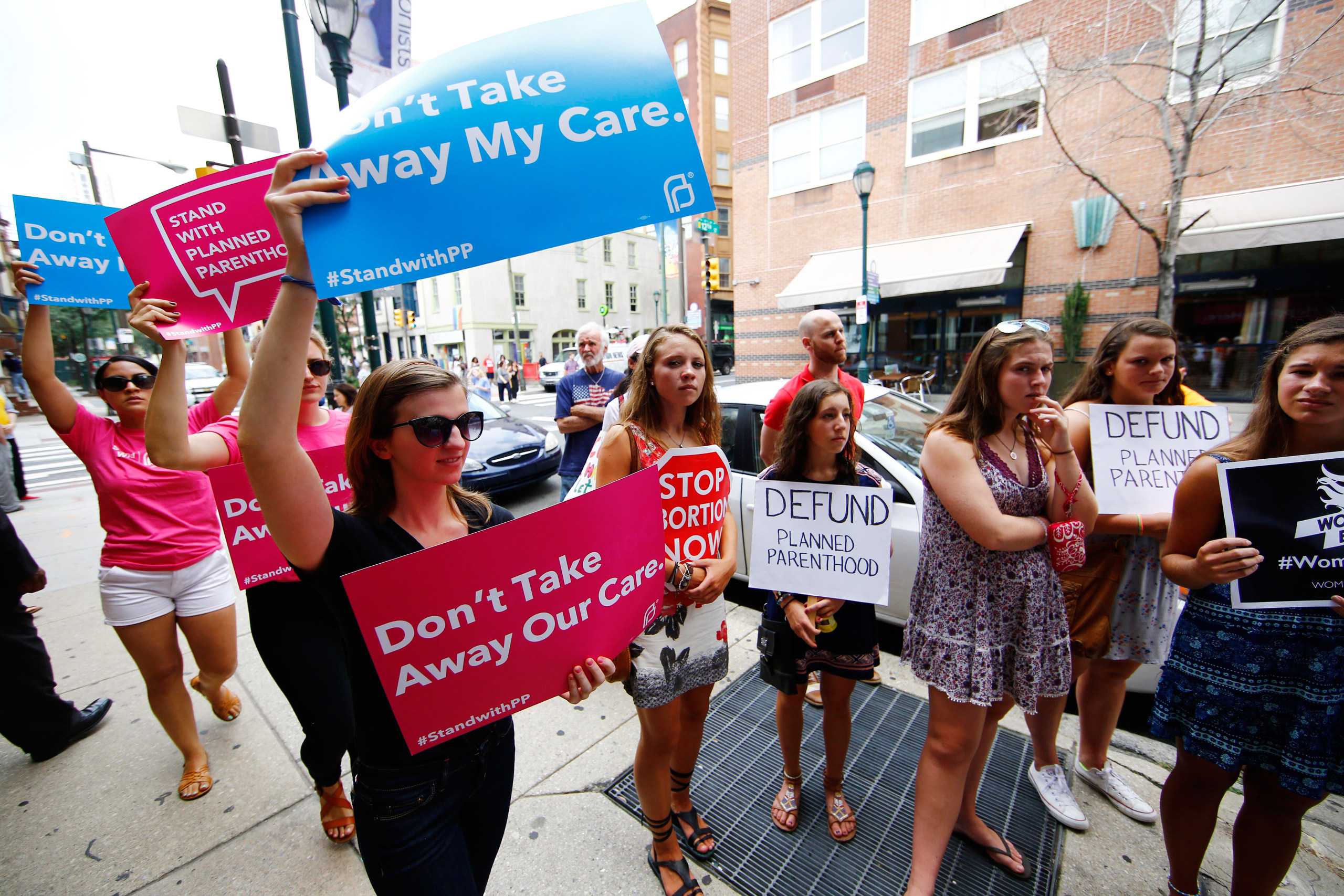 Opponents and supporters of Planned Parenthood demonstrate Tuesday, July 28, 2015, in Philadelphia. Anti-abortion activists are calling for an end to government funding for the nonprofit reproductive services organization. (AP Photo/Matt Rourke)