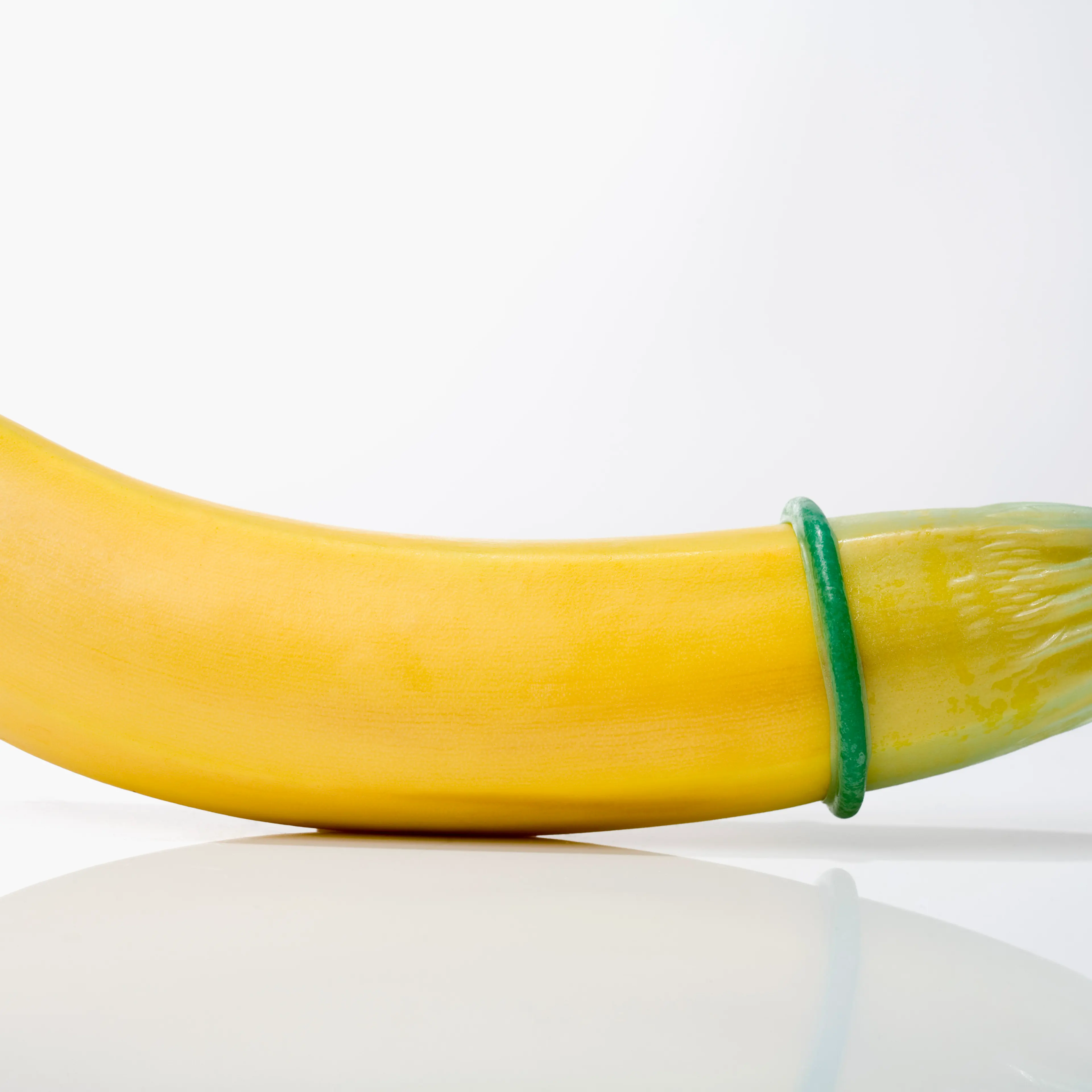 "Condom on banana, close-up"