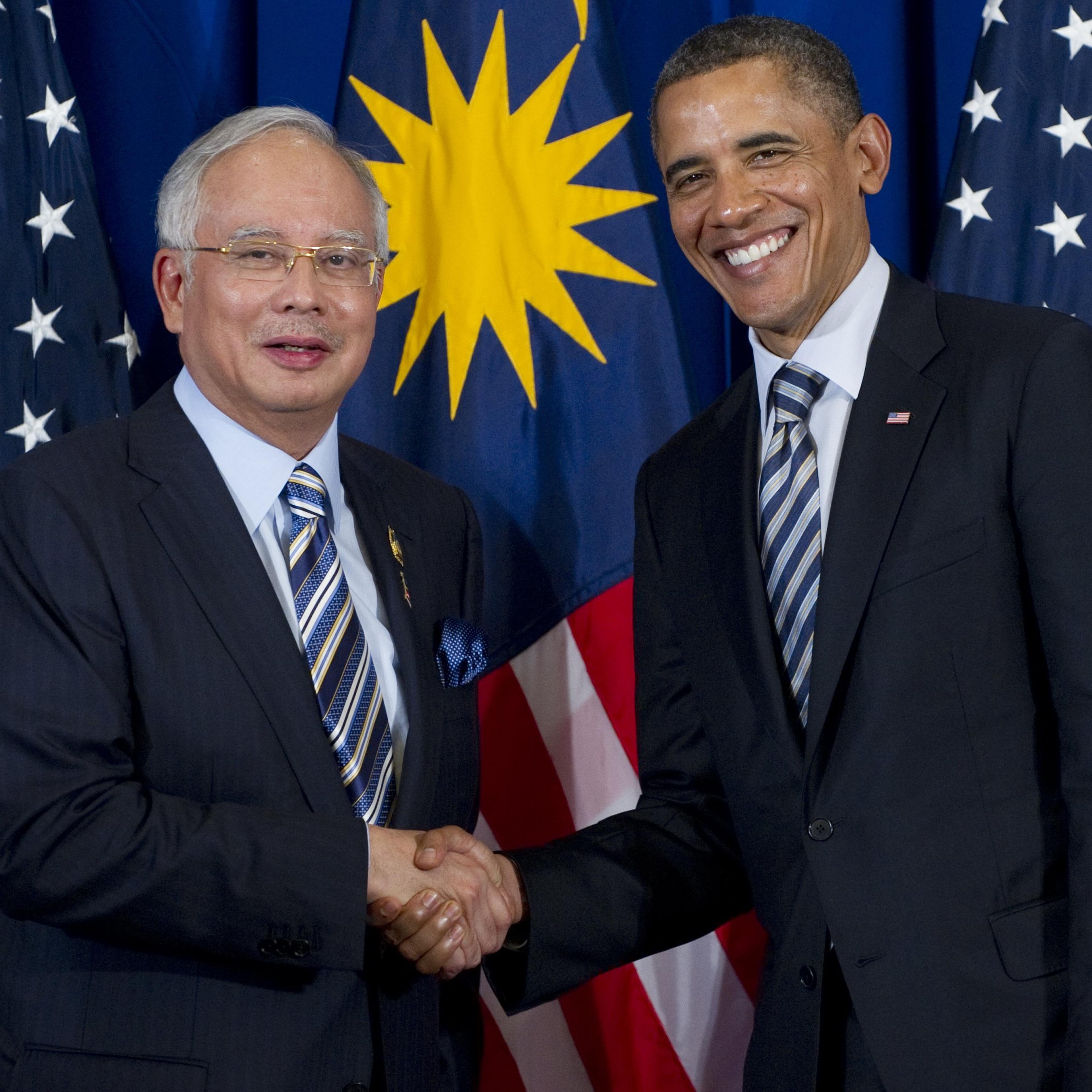 U.S. President Barack Obama shakes hands with Prime Minister Najib Razak of Malaysia during a meeting on the sidelines of the ASEAN and East Asia summits in Nusa Dua on Indonesia's resort island of Bali, on Nov. 18, 2011.