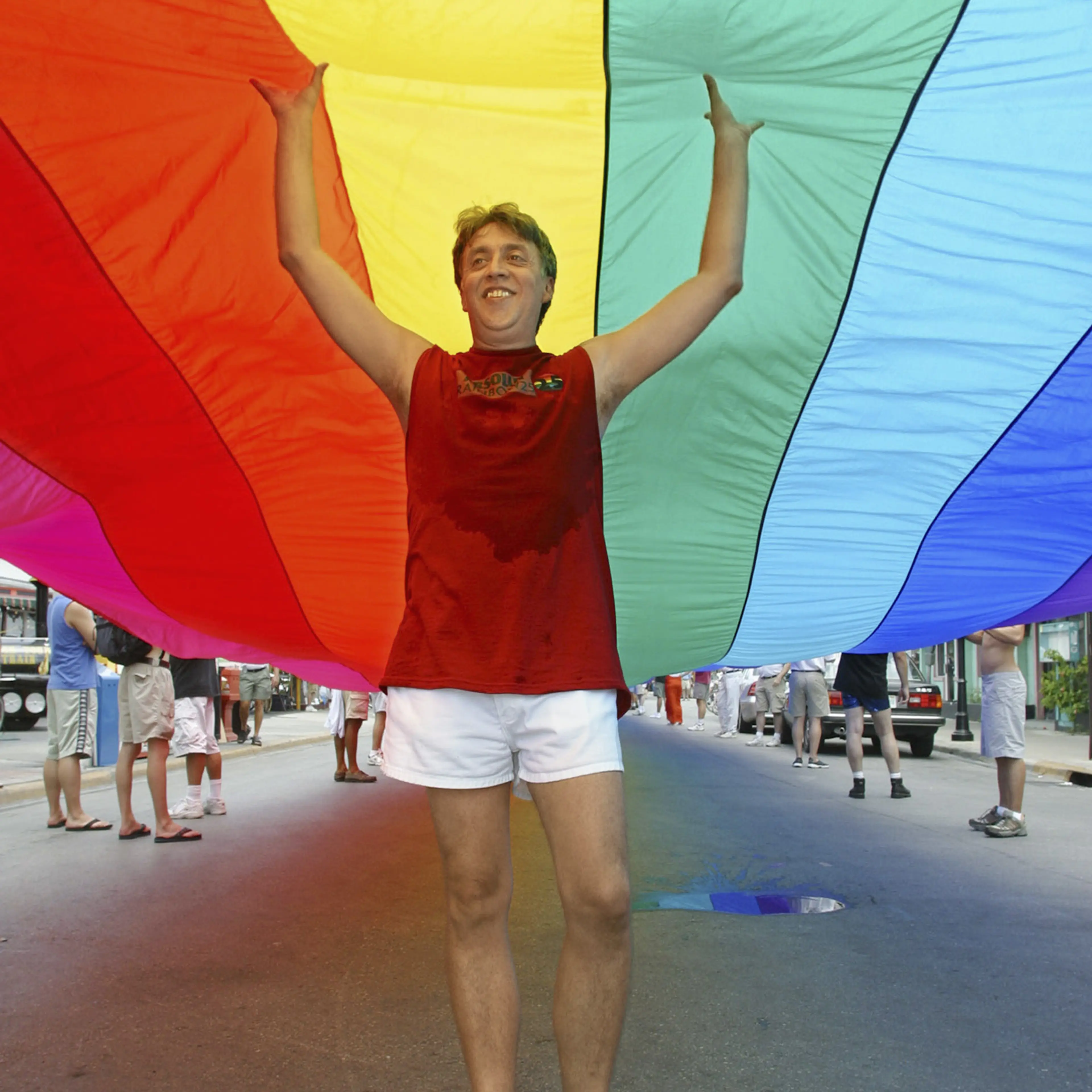 Baker helps stretch the world’s longest rainbow flag in 2003