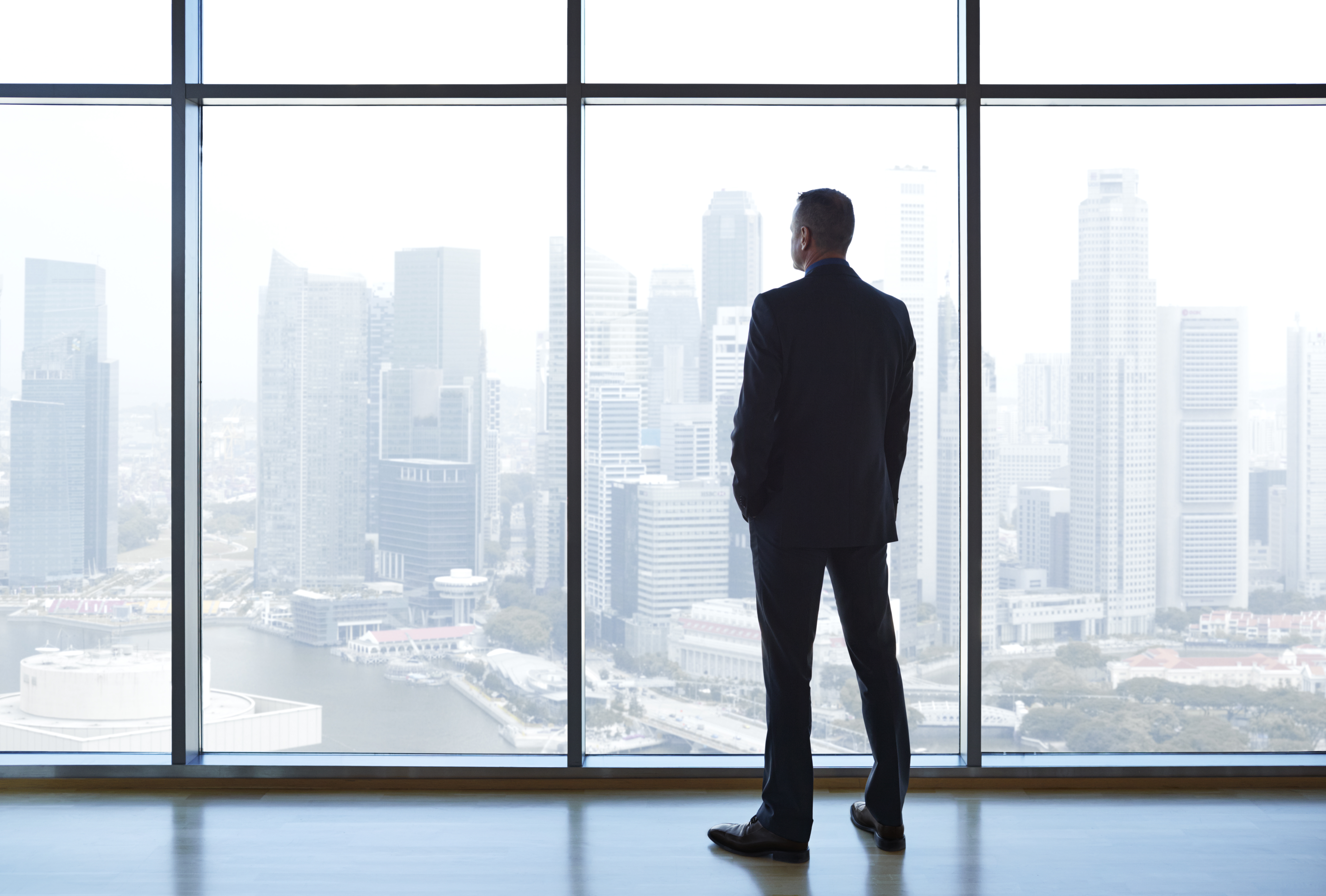 businessman-looking-out-window