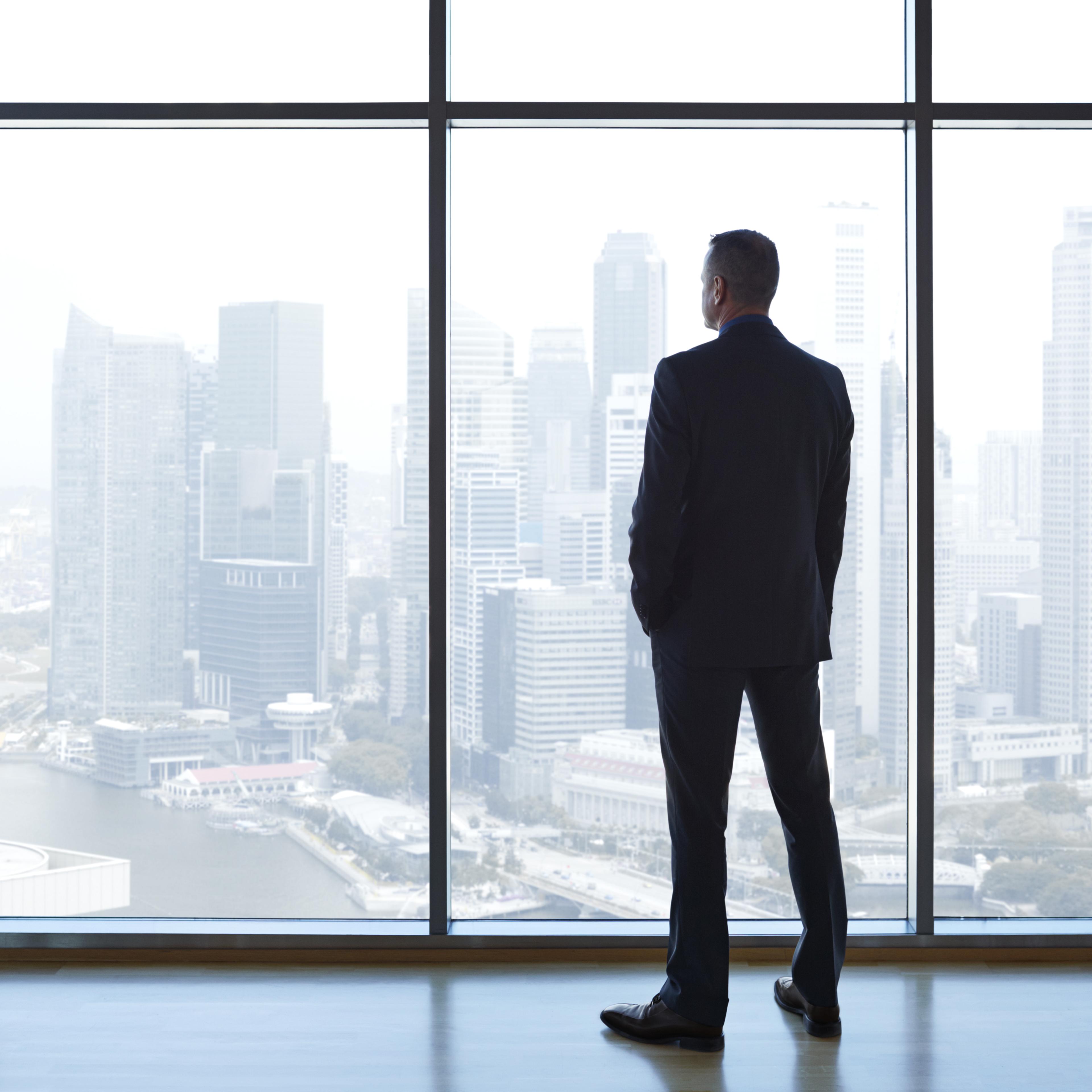 businessman-looking-out-window