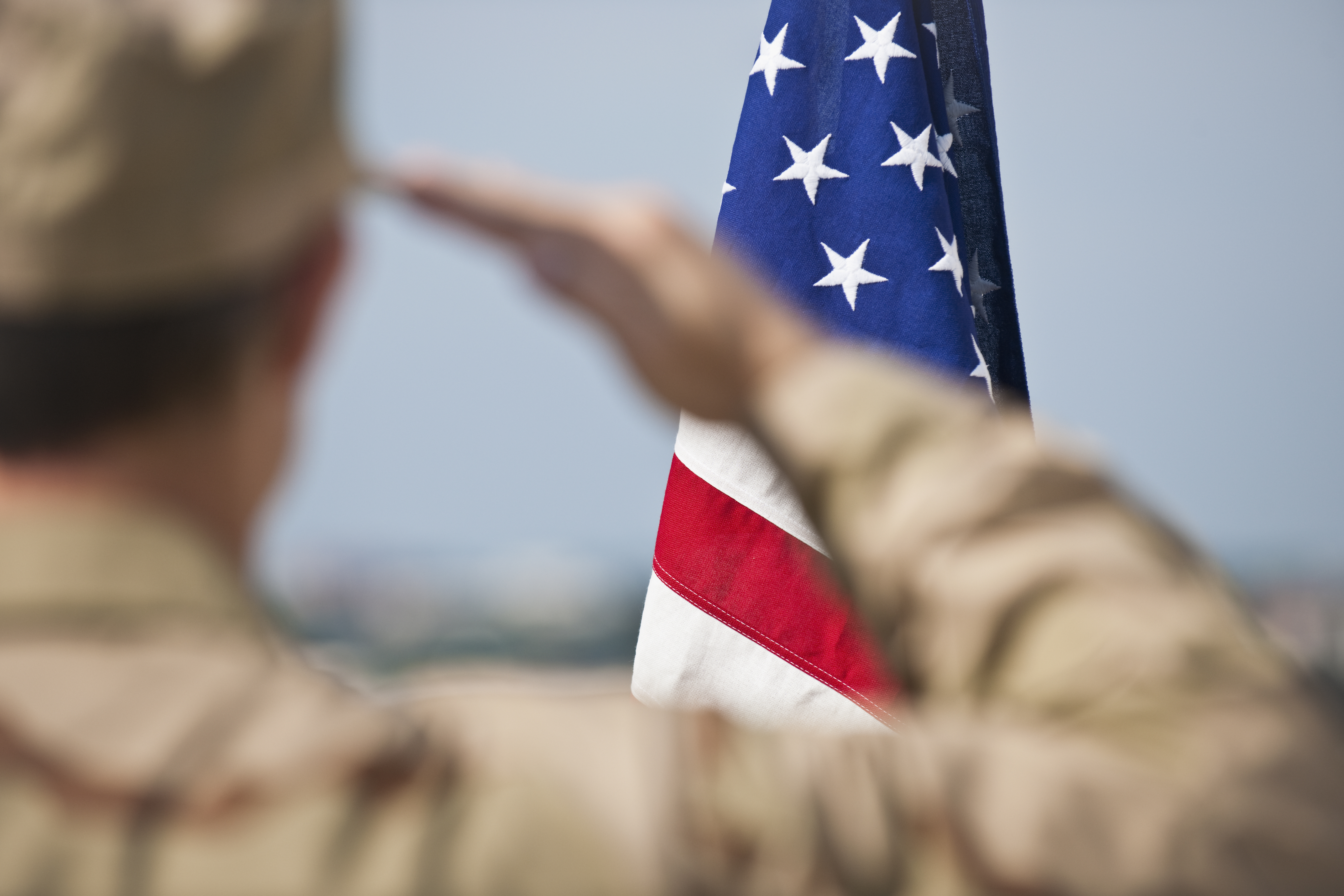 soldier saluting flag