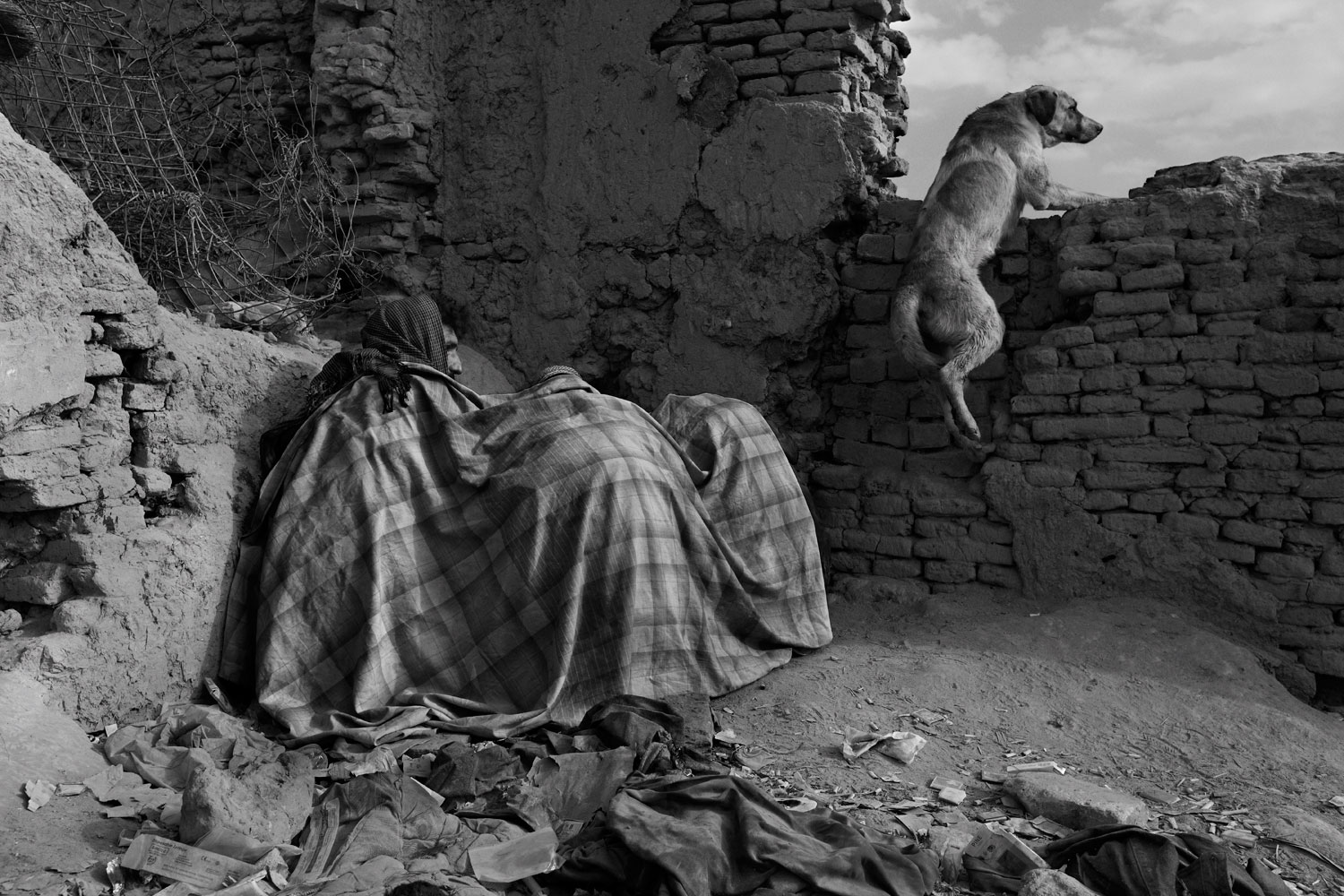 Inside the bomb-blasted ruins of Kabul’s old town, the morning crowd of heroin addicts huddle under woolen blankets to keep the cold out and noxious smoke in.
