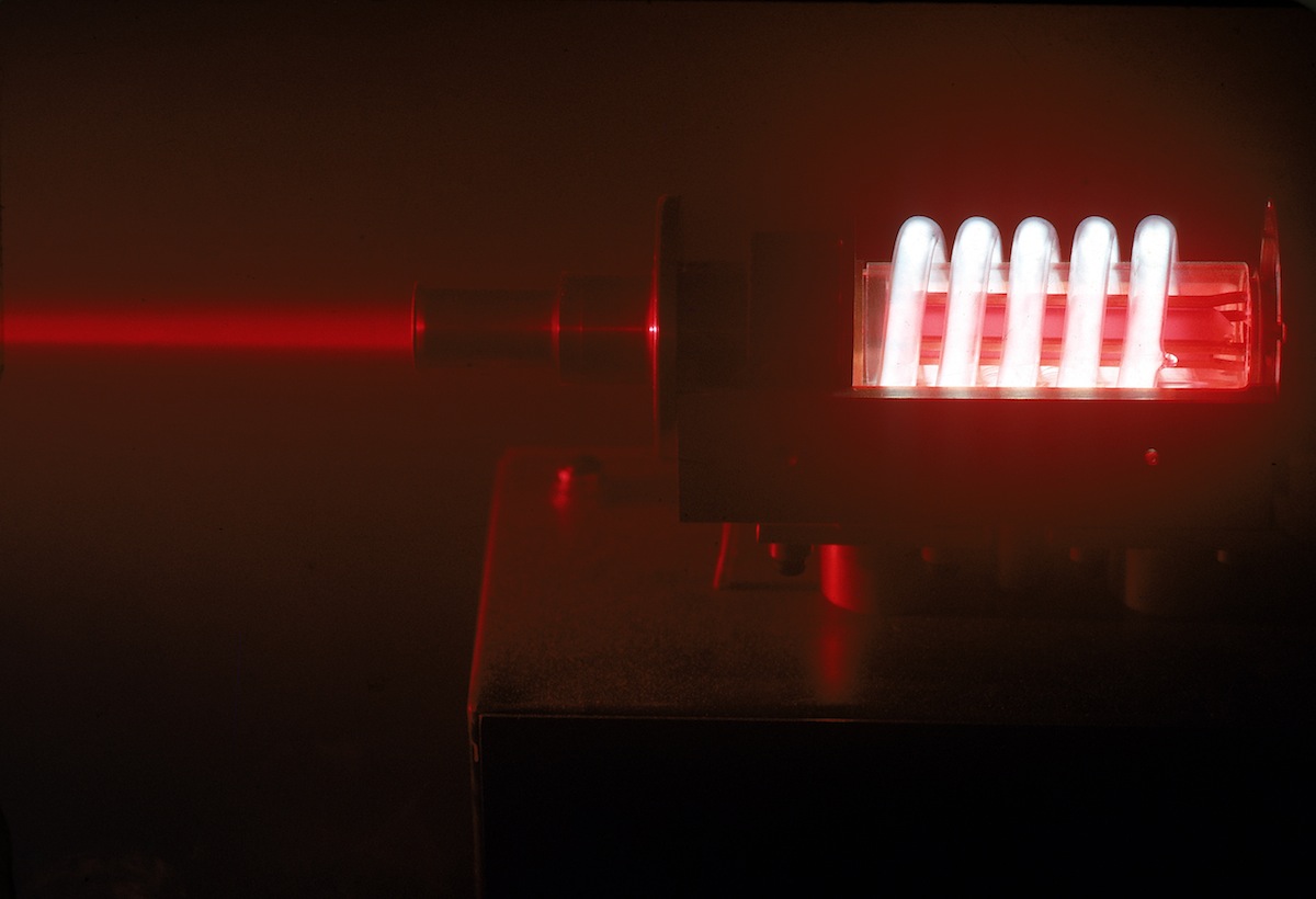 Illuminated coils of projector used to create lase